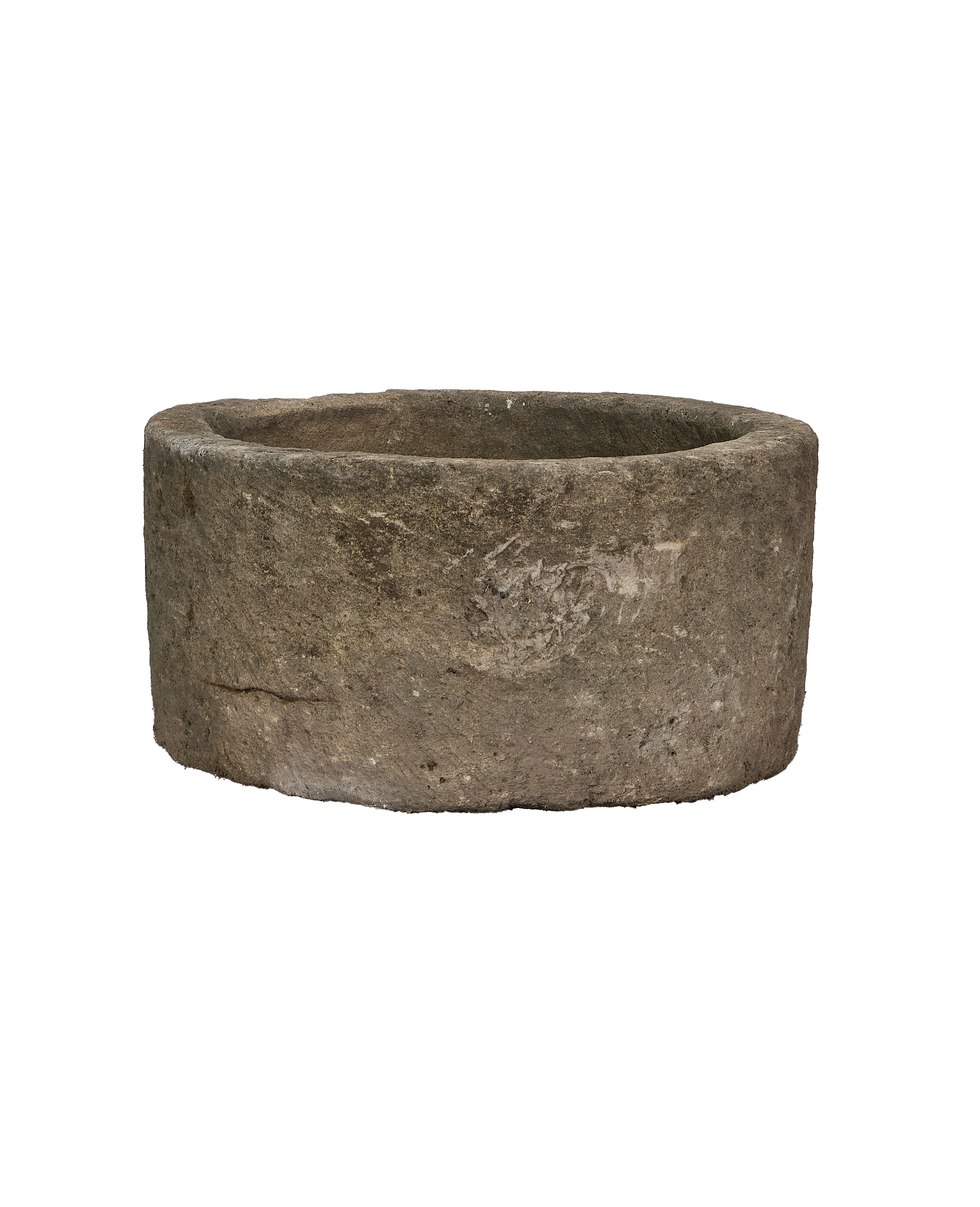 Vintage Indonesian round limestone trough, showing weathered texture and interior rim.