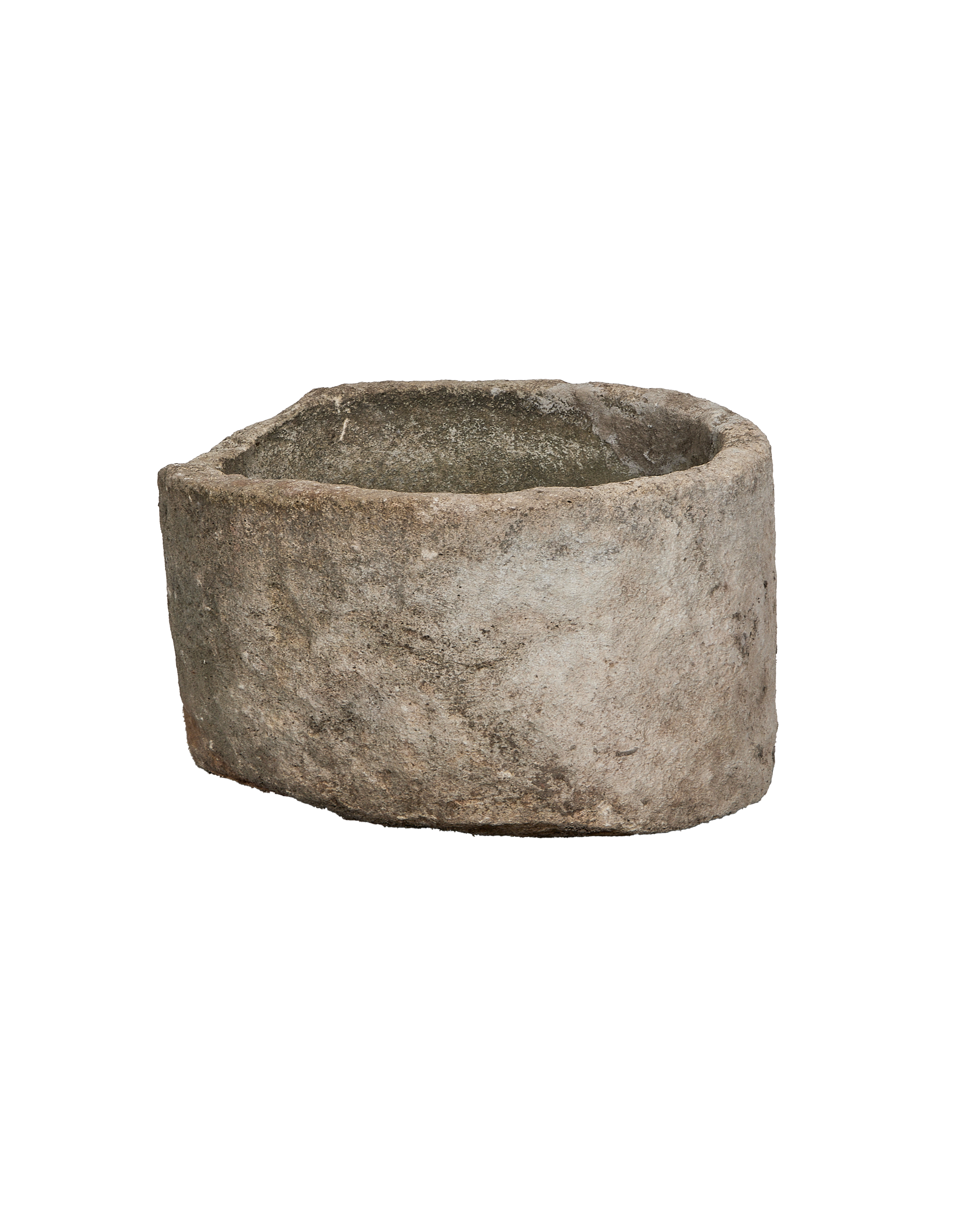 Vintage round Indonesian limestone trough, showing a slightly angled profile and aged patina.