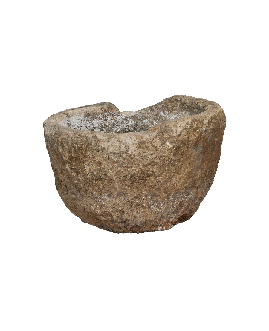 Vintage Indonesian limestone trough, round, showcasing natural rock texture and aged interior.