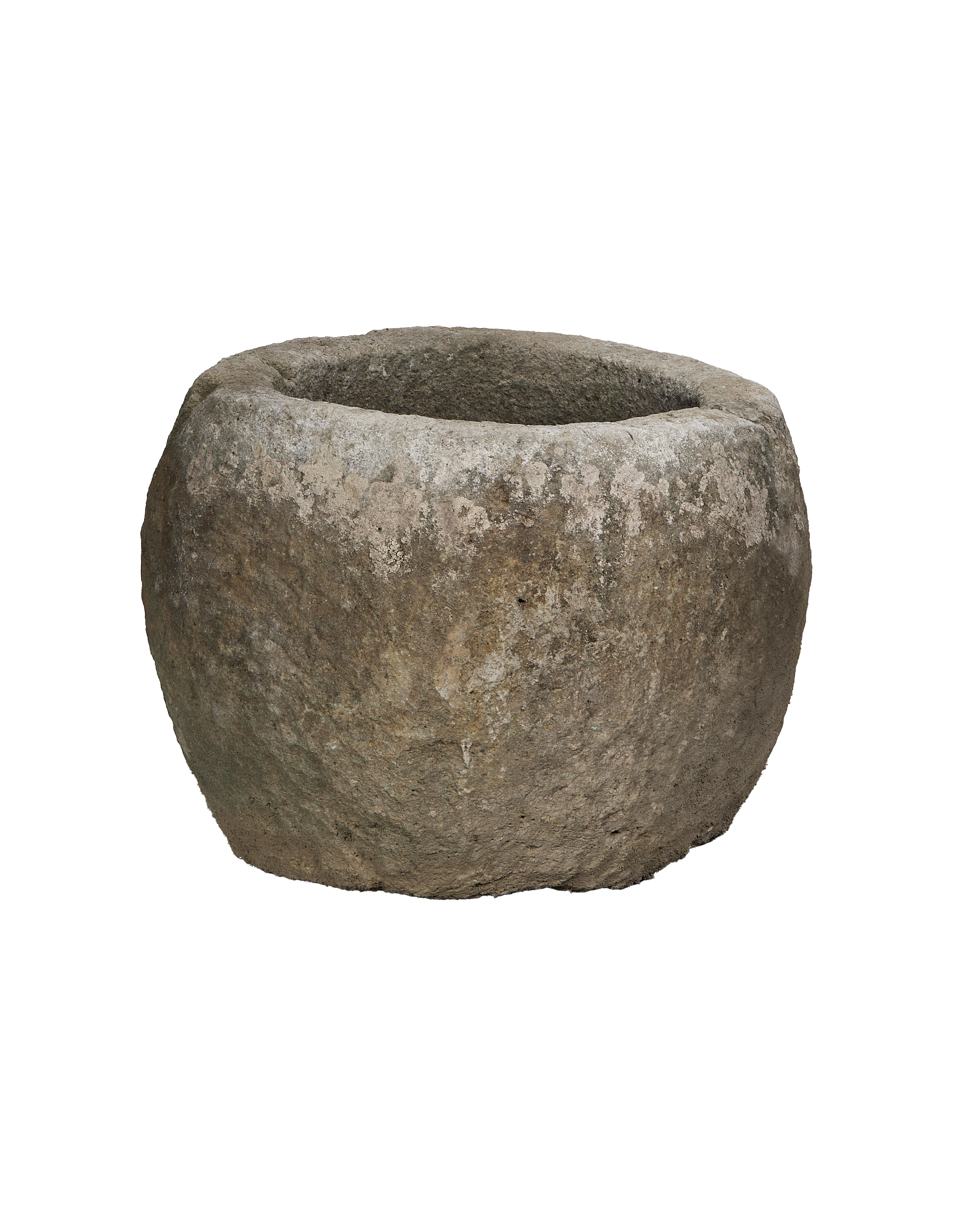 Vintage Indonesian round limestone trough, showing weathered texture from an elevated perspective.