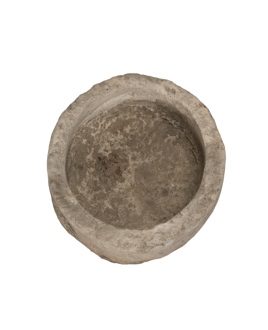 Vintage Indonesian round limestone trough, top-down view showing interior texture.