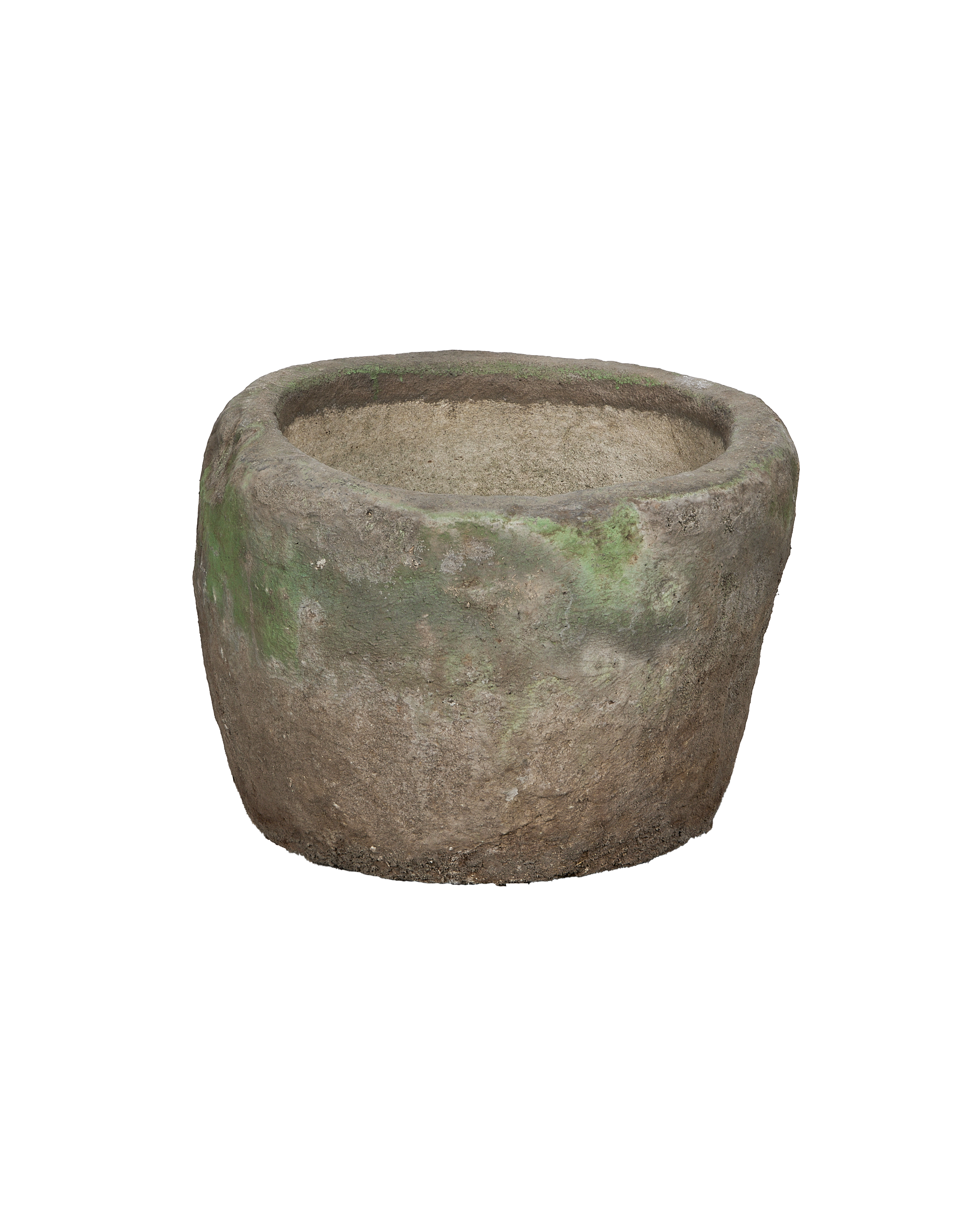 Vintage Indonesian round limestone trough, showing internal textured surface and aged green patination, side view.