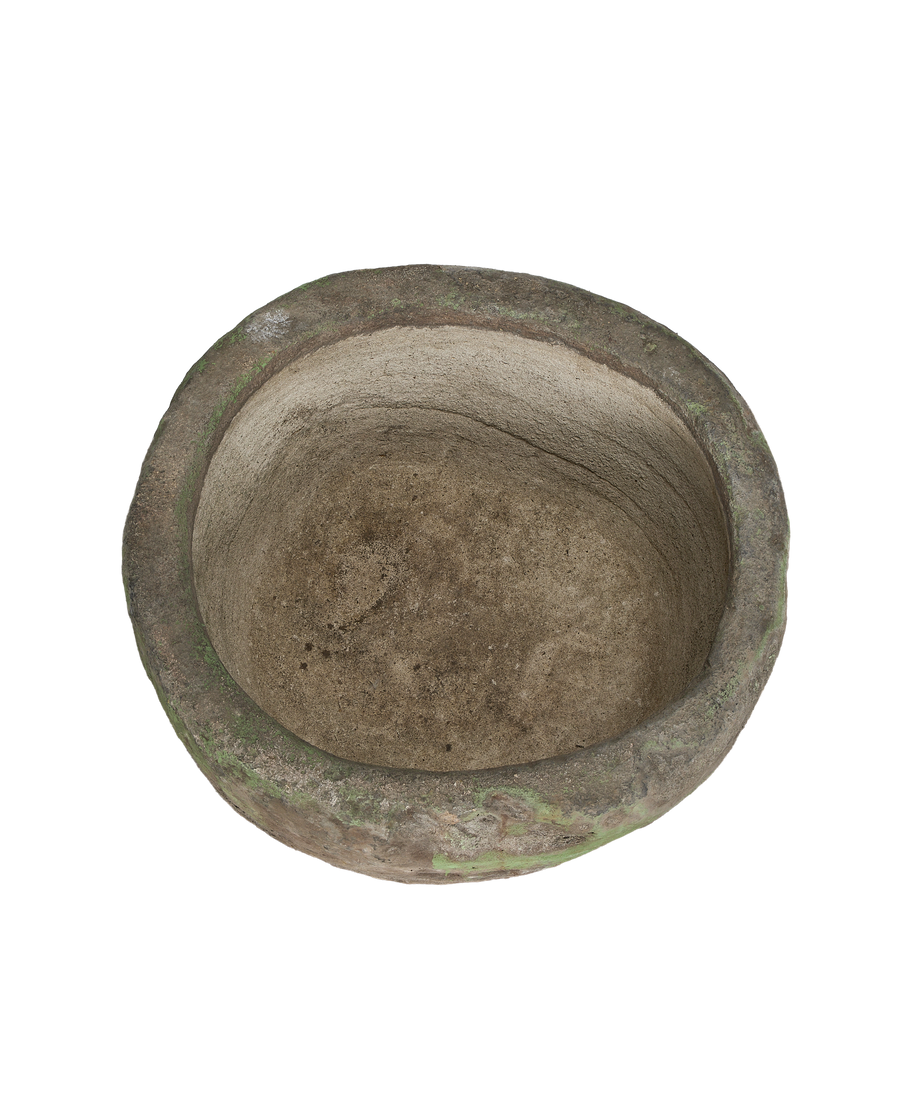 Vintage Indonesian round limestone trough, aged interior surface and rim with natural moss growth.
