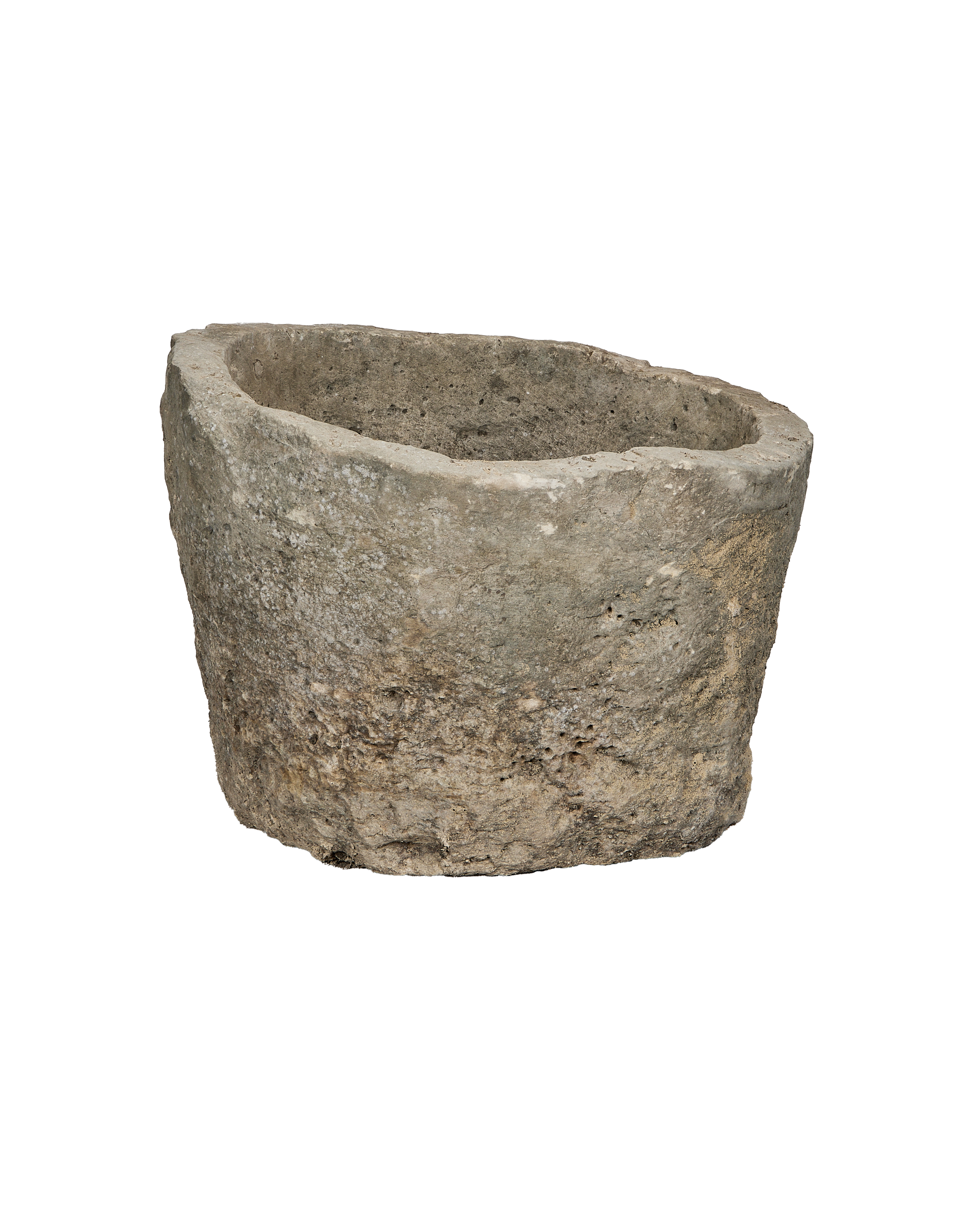 Vintage Indonesian round limestone trough, elevated view showing weathered texture and interior.