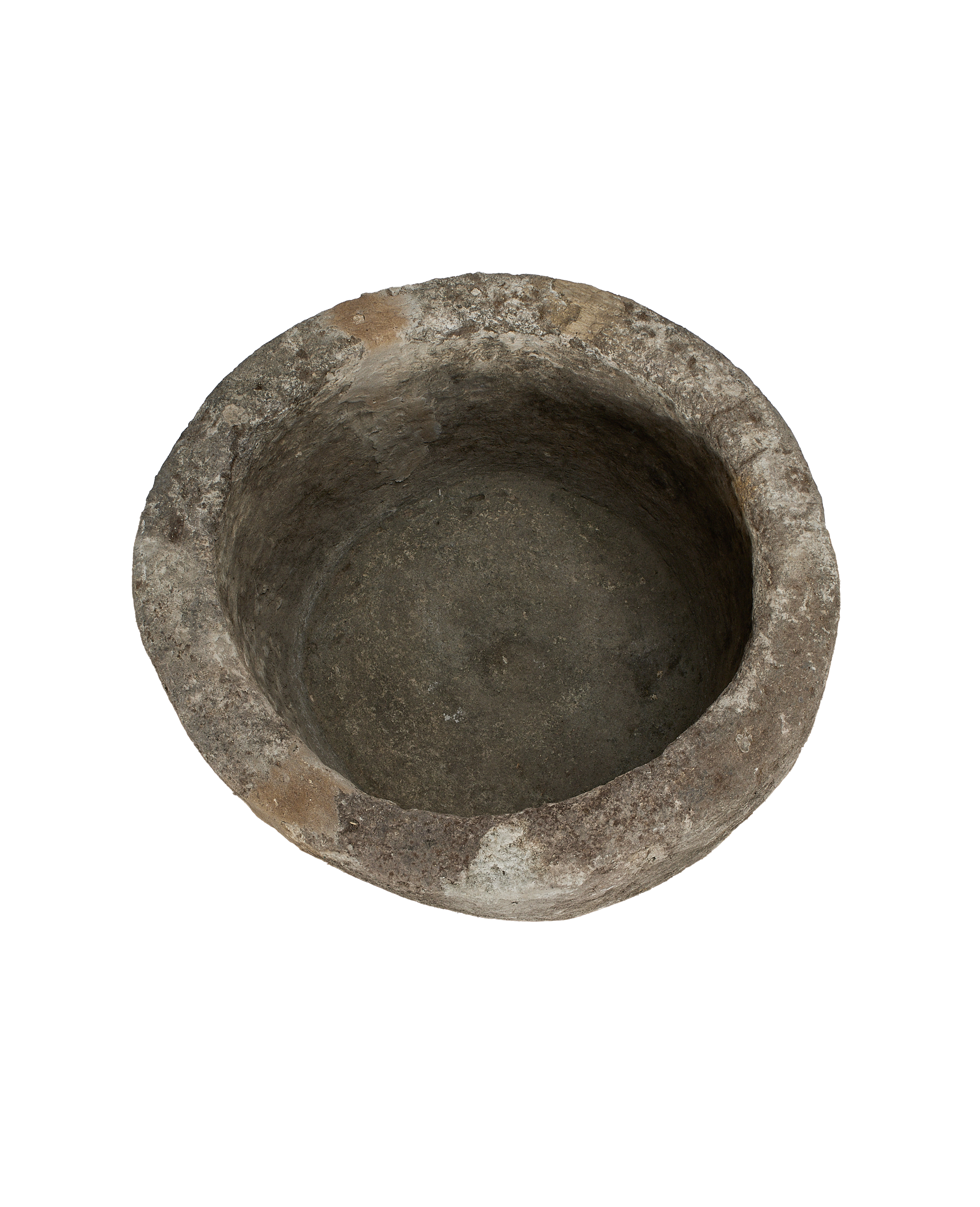 Vintage round Indonesian limestone trough, showing weathered interior surface and rustic rim.