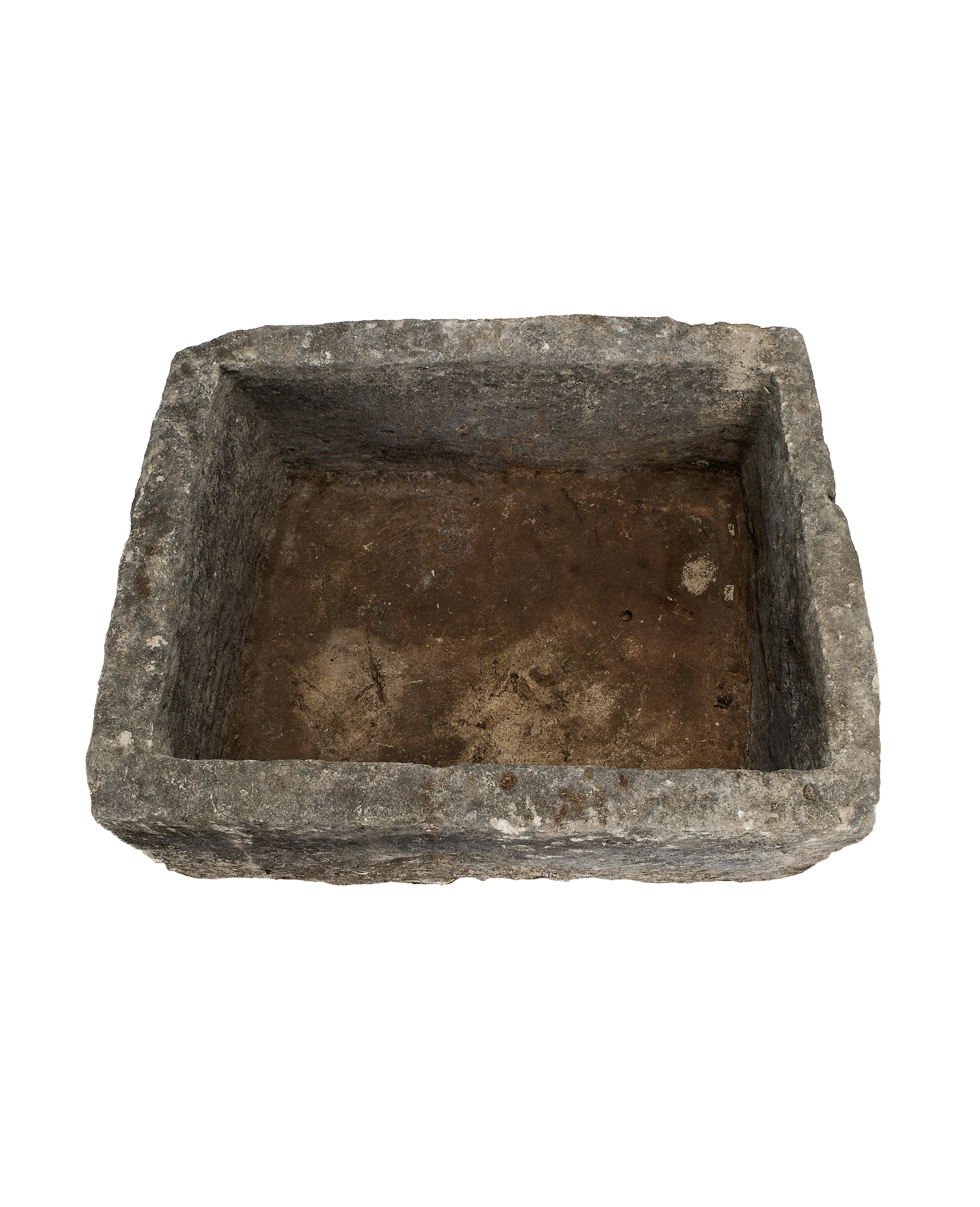 Vintage Indonesian limestone trough, showing the weathered internal texture and rough-cut edges.