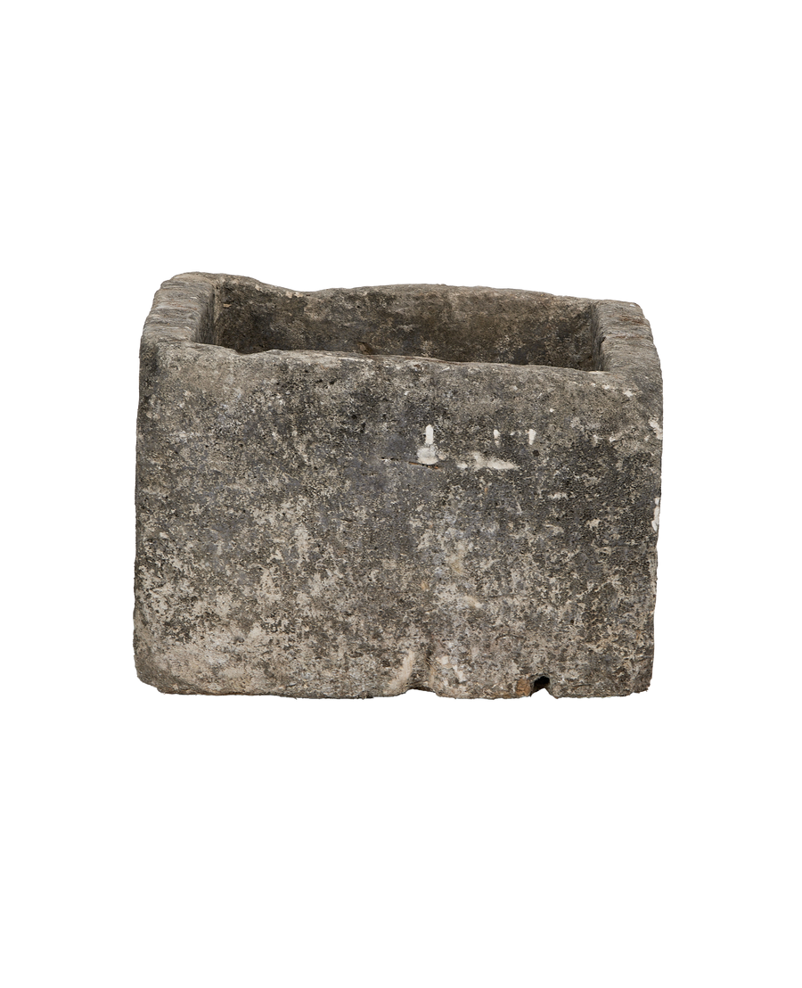 Vintage limestone trough from Indonesia, exterior features weathered rock texture and slight chipping.