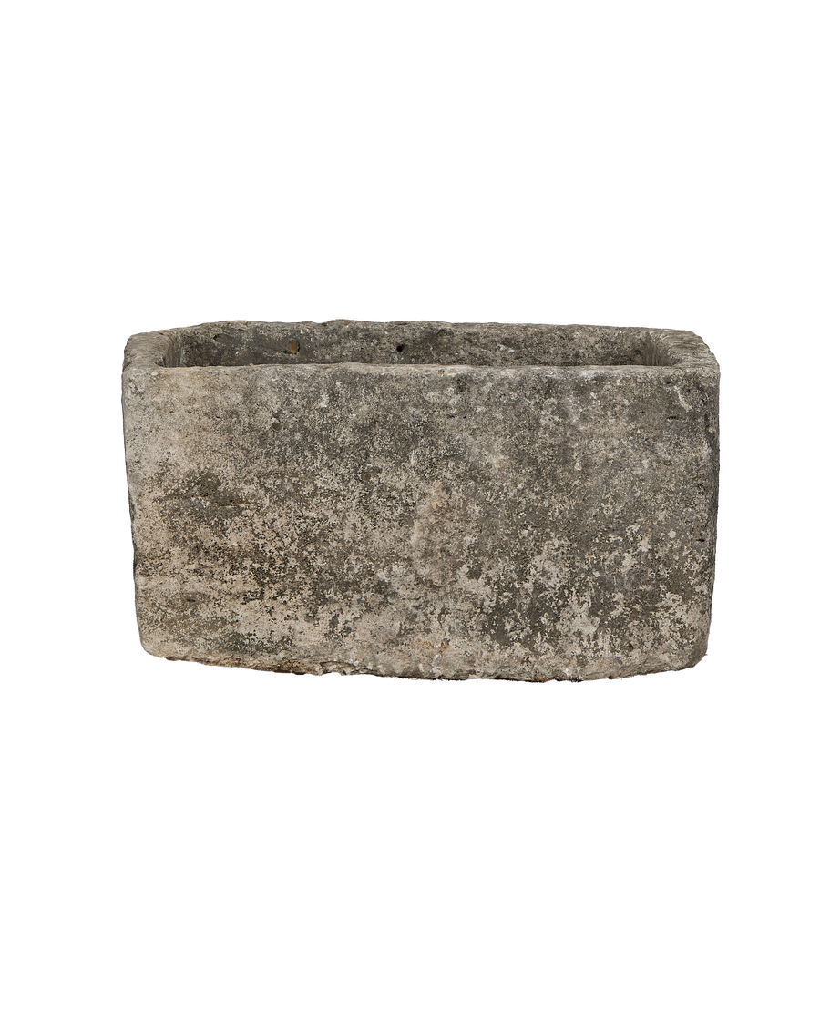 Vintage Indonesian rectangular limestone trough, showing weathered texture on side and top edges.