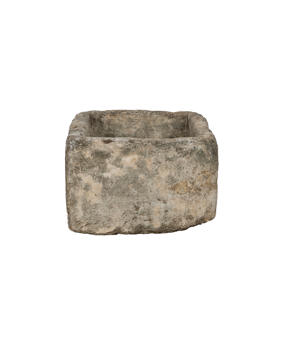 Vintage Indonesian limestone trough, displaying rugged texture and weathered sides.