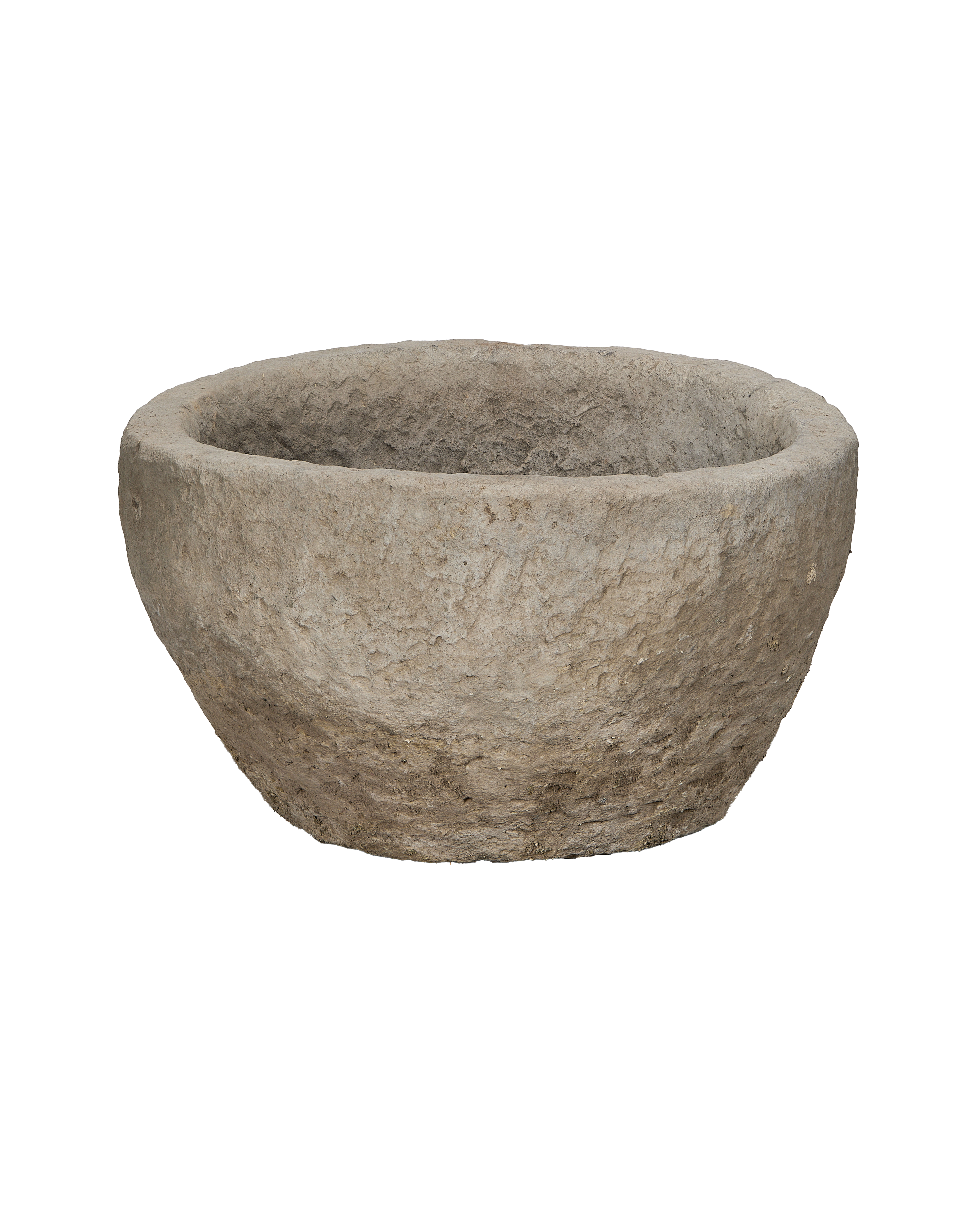 Vintage Indonesian round limestone planter trough, showing rough textured exterior.