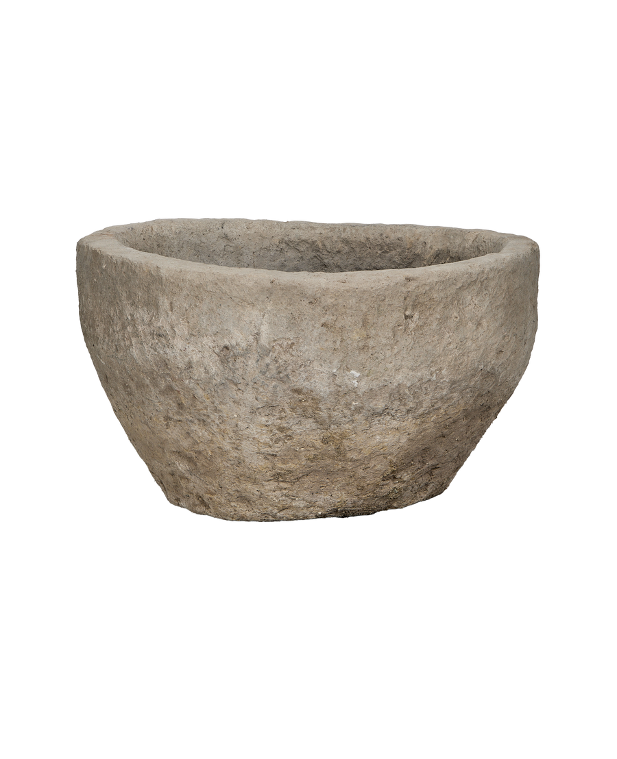 Vintage round Indonesian limestone trough, OAK style, showing its roughly textured, weathered edge.