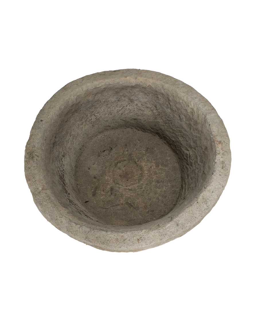 Vintage Indonesian limestone trough (top-down view) showing rustic interior and bowl depth.