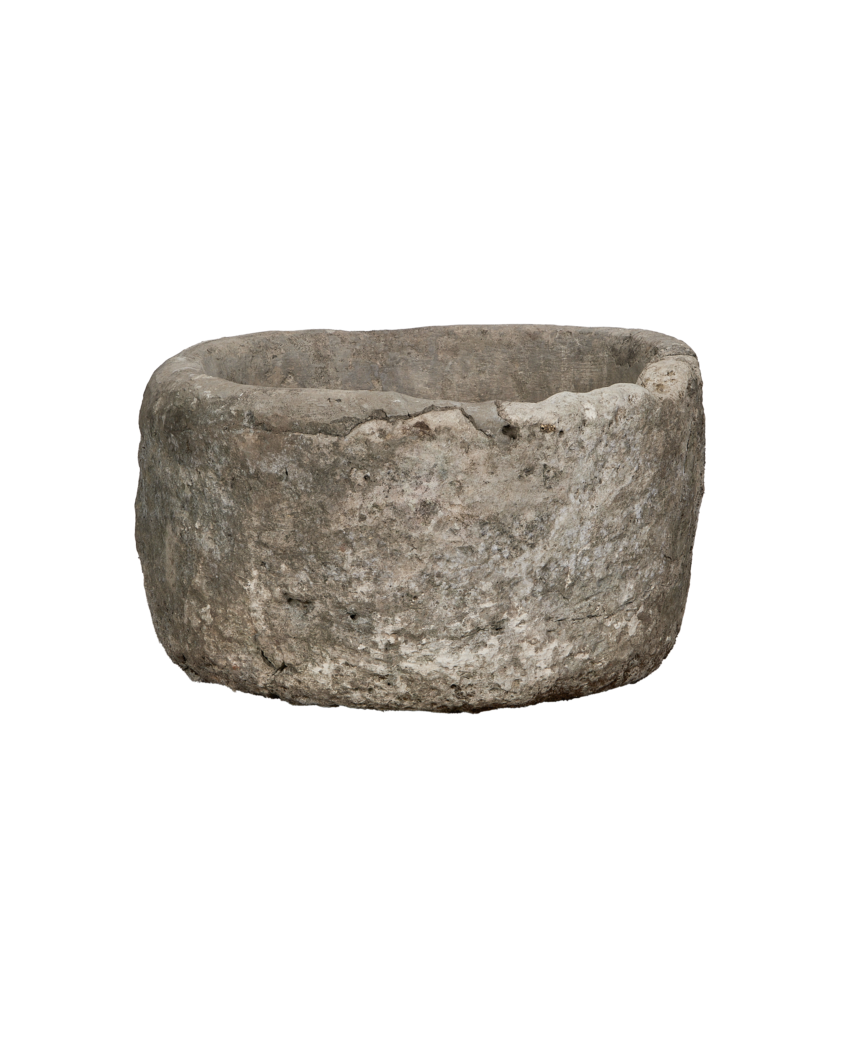 Vintage round Indonesian limestone trough, showing a slightly angled profile and weathered texture.