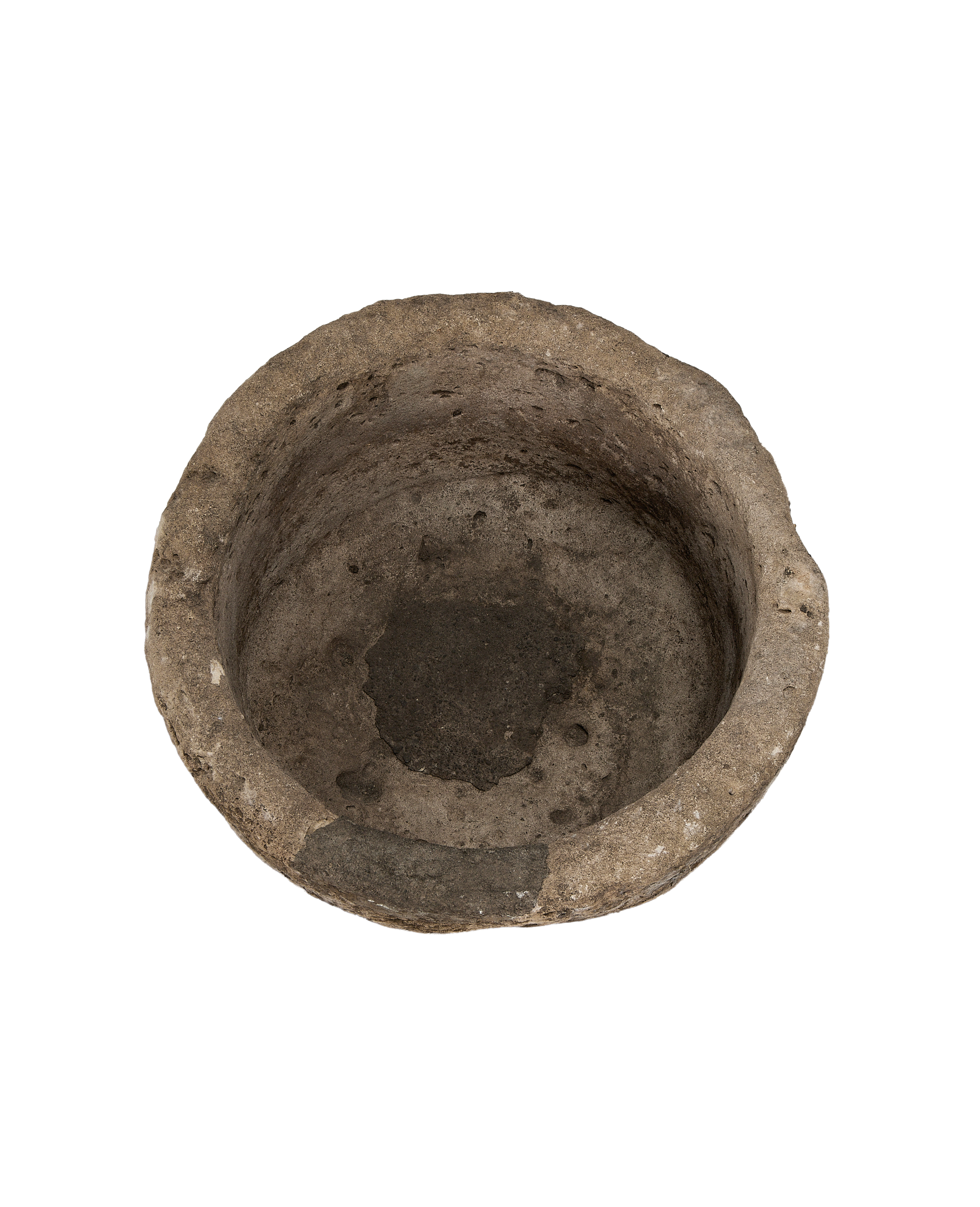 Vintage Indonesian round limestone trough, showing weathered interior surface texture from above.