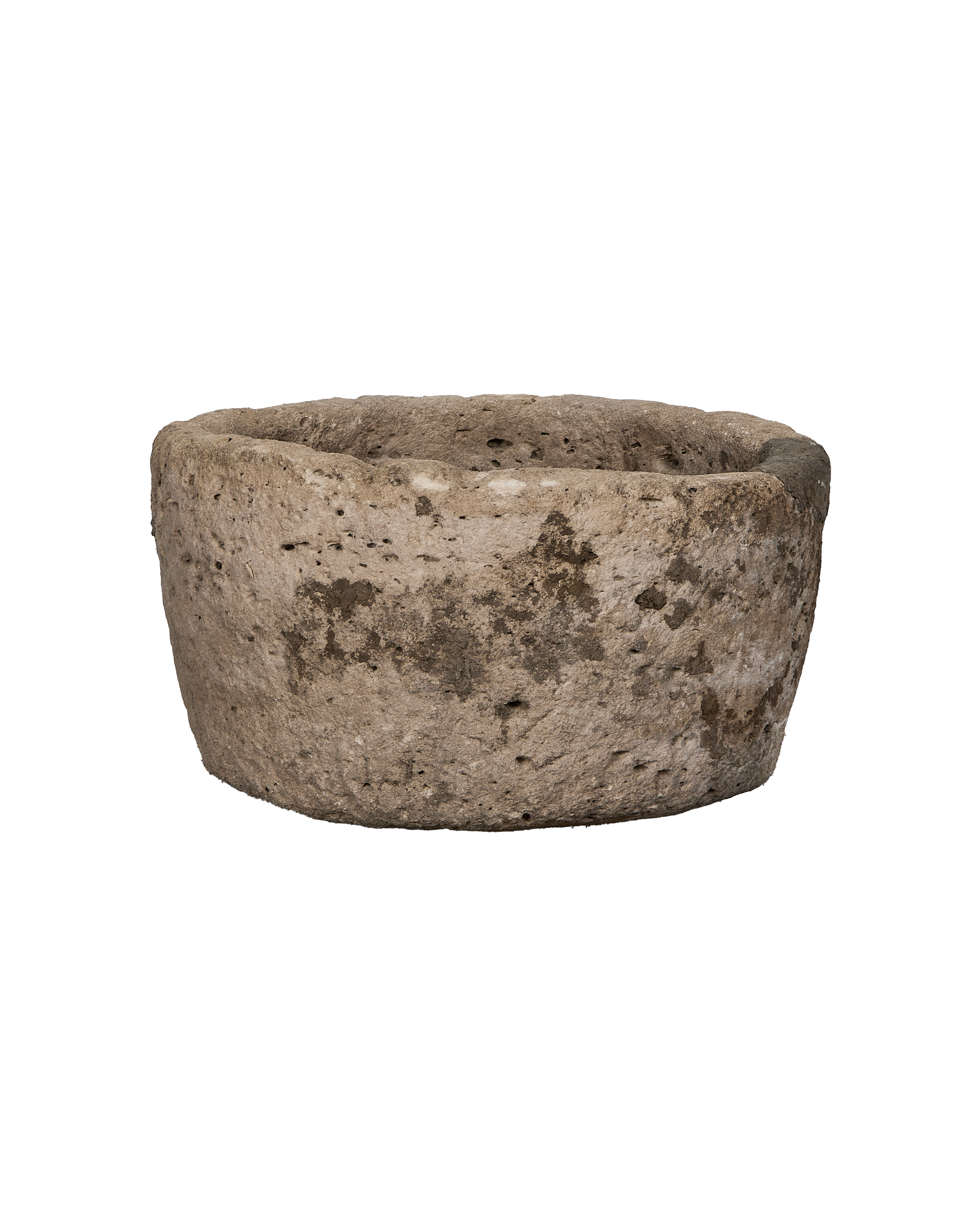 Vintage round limestone trough from Indonesia, showing rough texture, pitting, and weathered surface.
