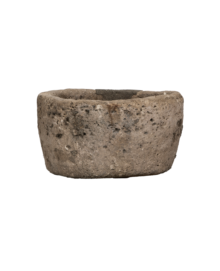 Vintage Indonesian limestone trough, OAK style, showing weathered texture and round form.
