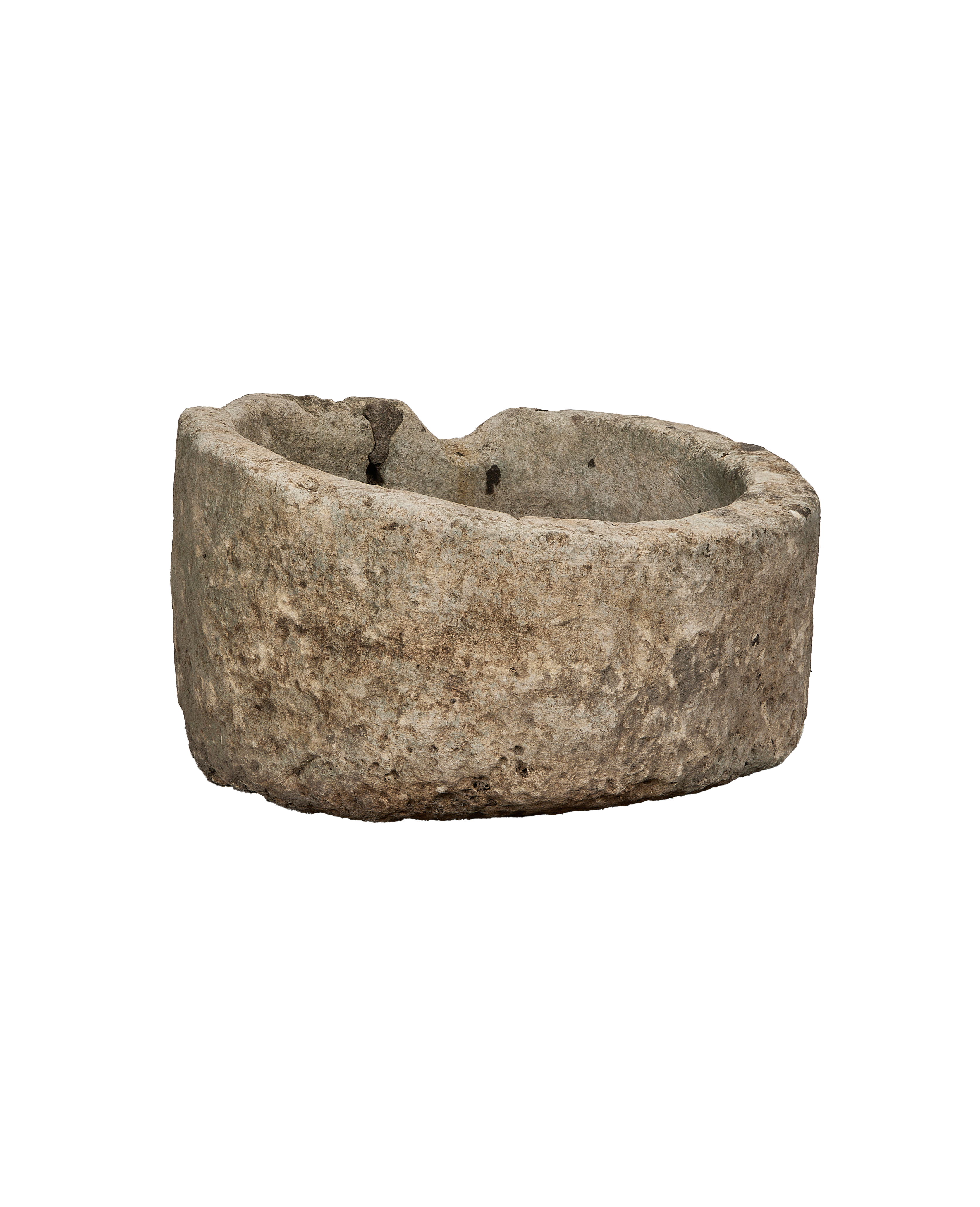 Vintage Indonesian round limestone trough, showing weathered side texture.