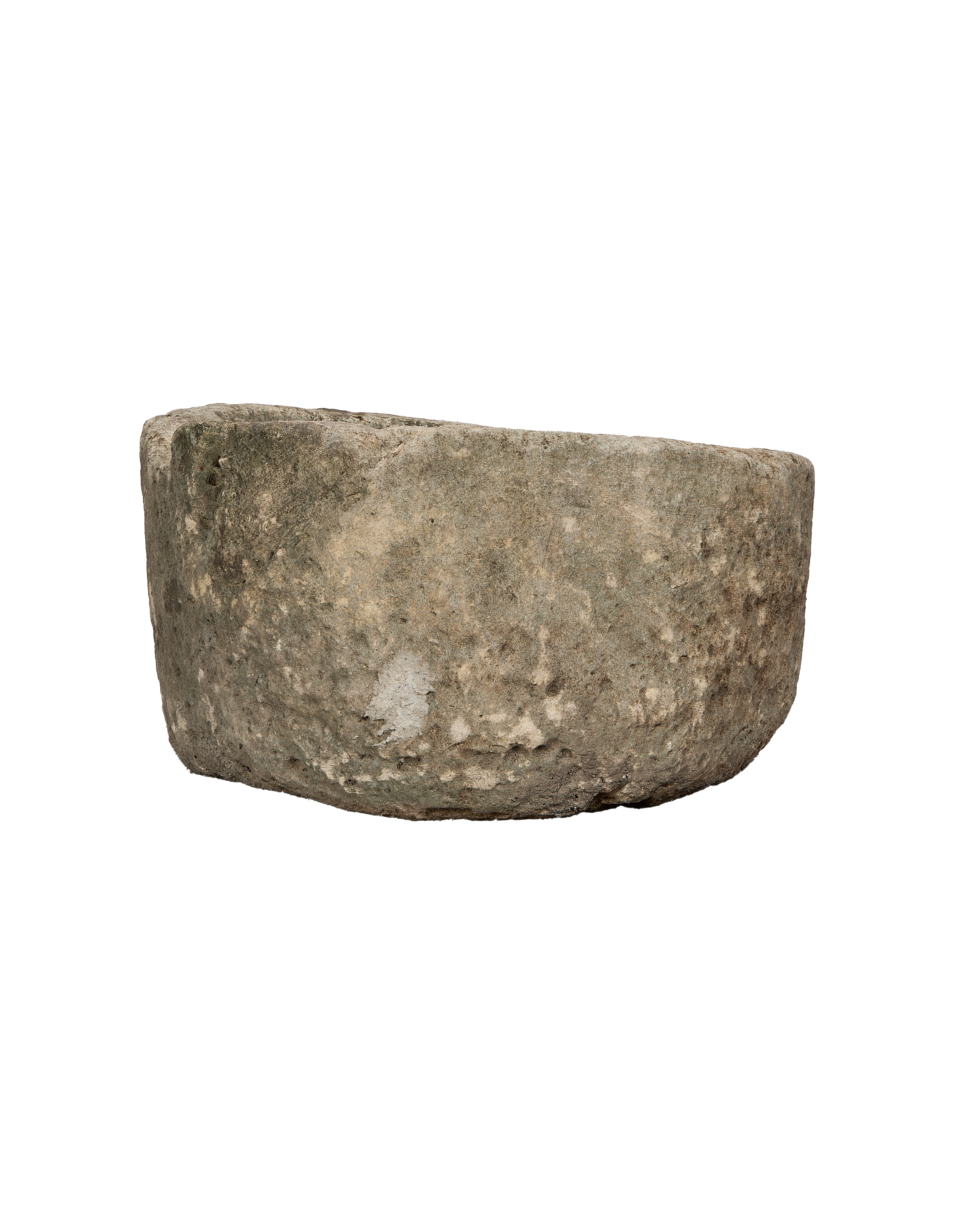 Bottom side/edge view of a vintage round limestone trough from Indonesia, showing texture.