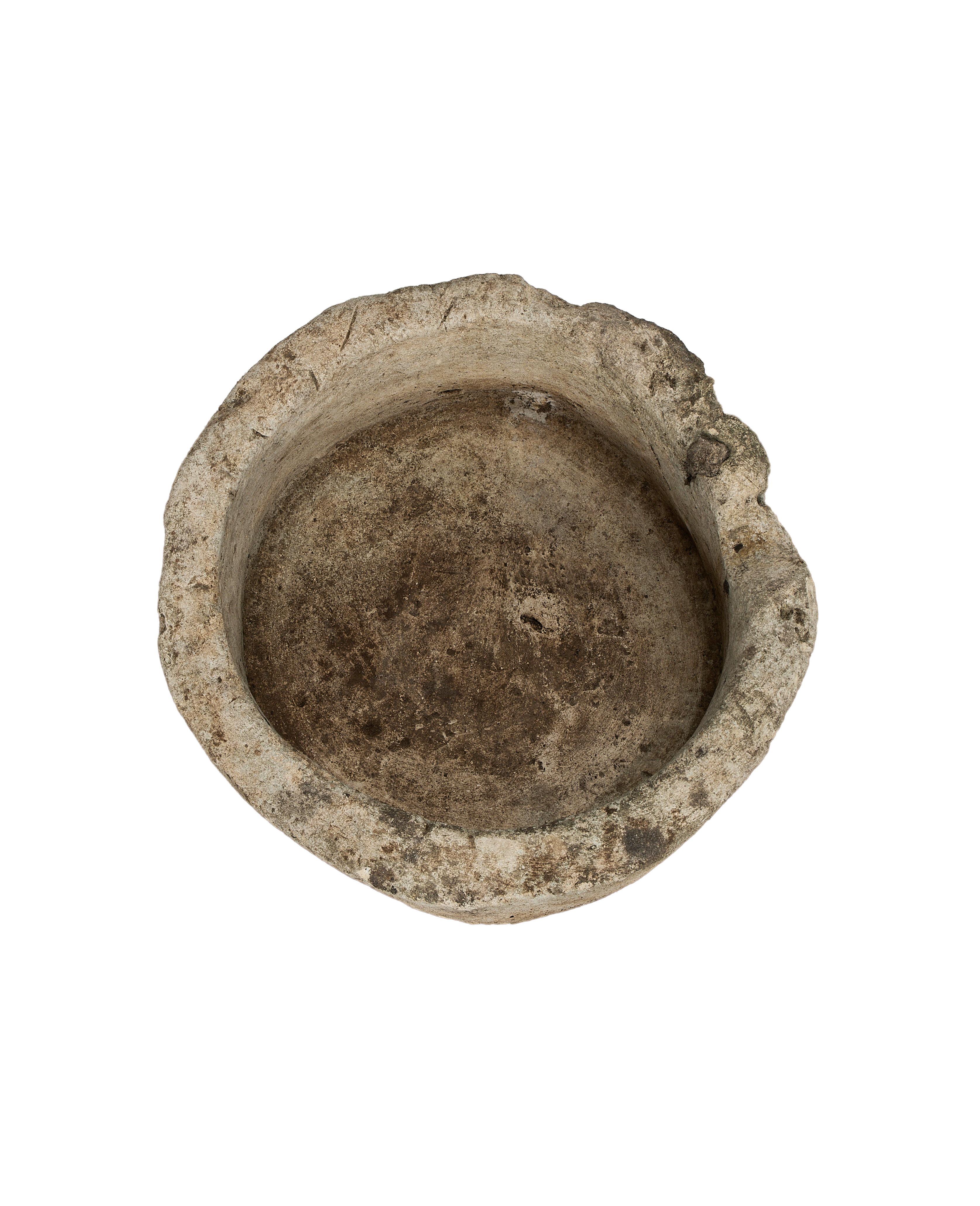 Vintage Indonesian limestone trough, showing the rough, aged textured interior and uneven rim.