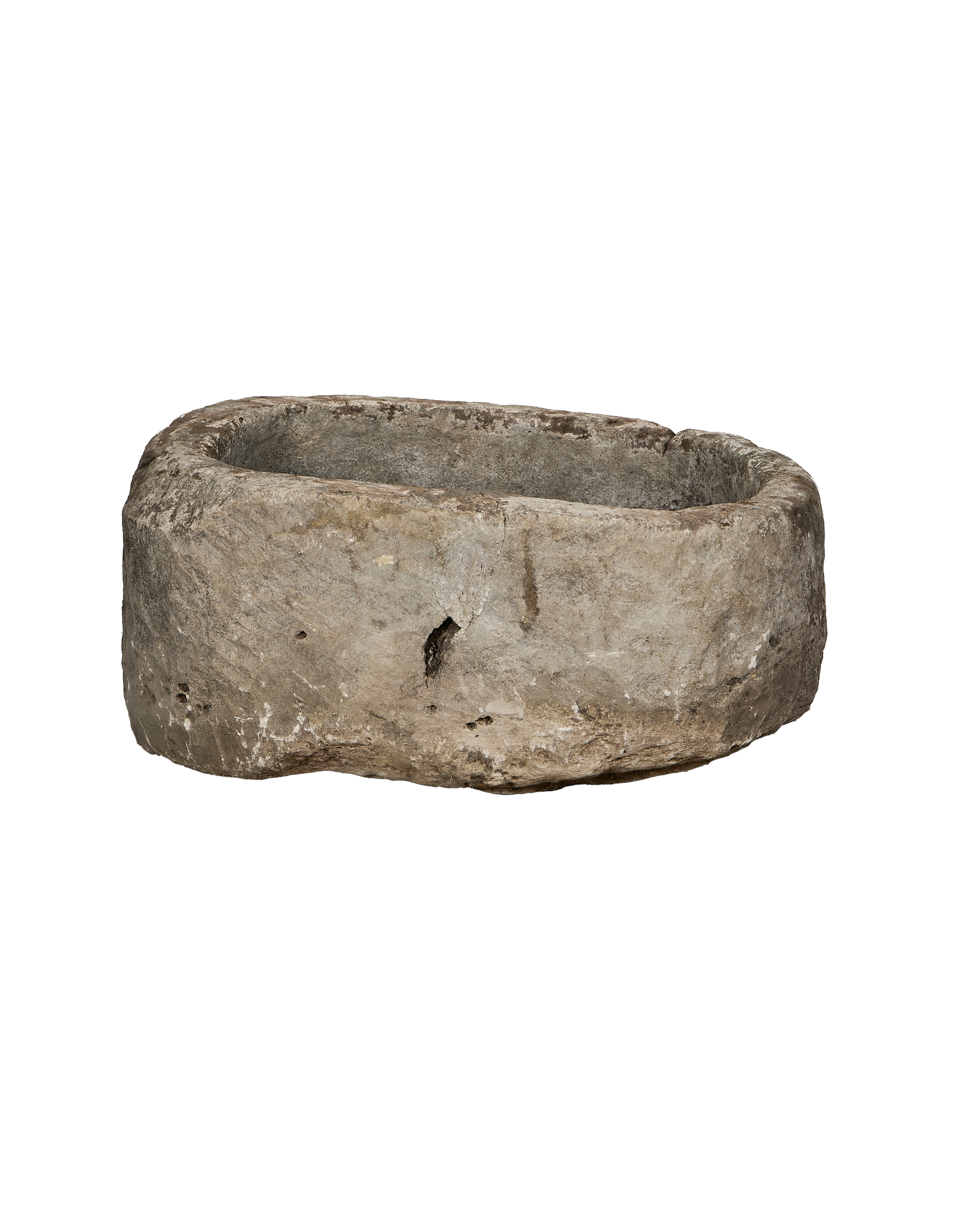 Vintage oblong Indonesian limestone trough, greyish brown with chiseled texture and visible age wear.