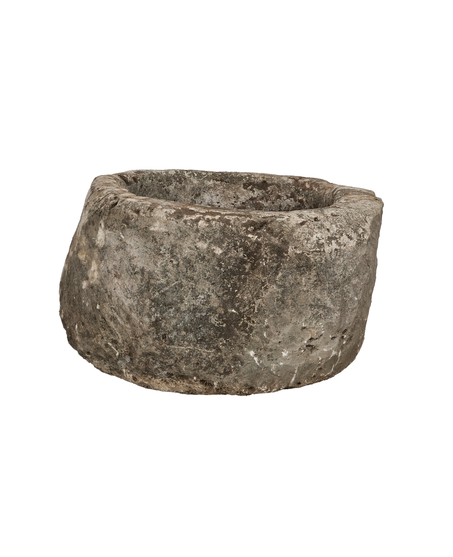 Vintage Indonesian oblong limestone trough, showing a rugged, weathered side texture.