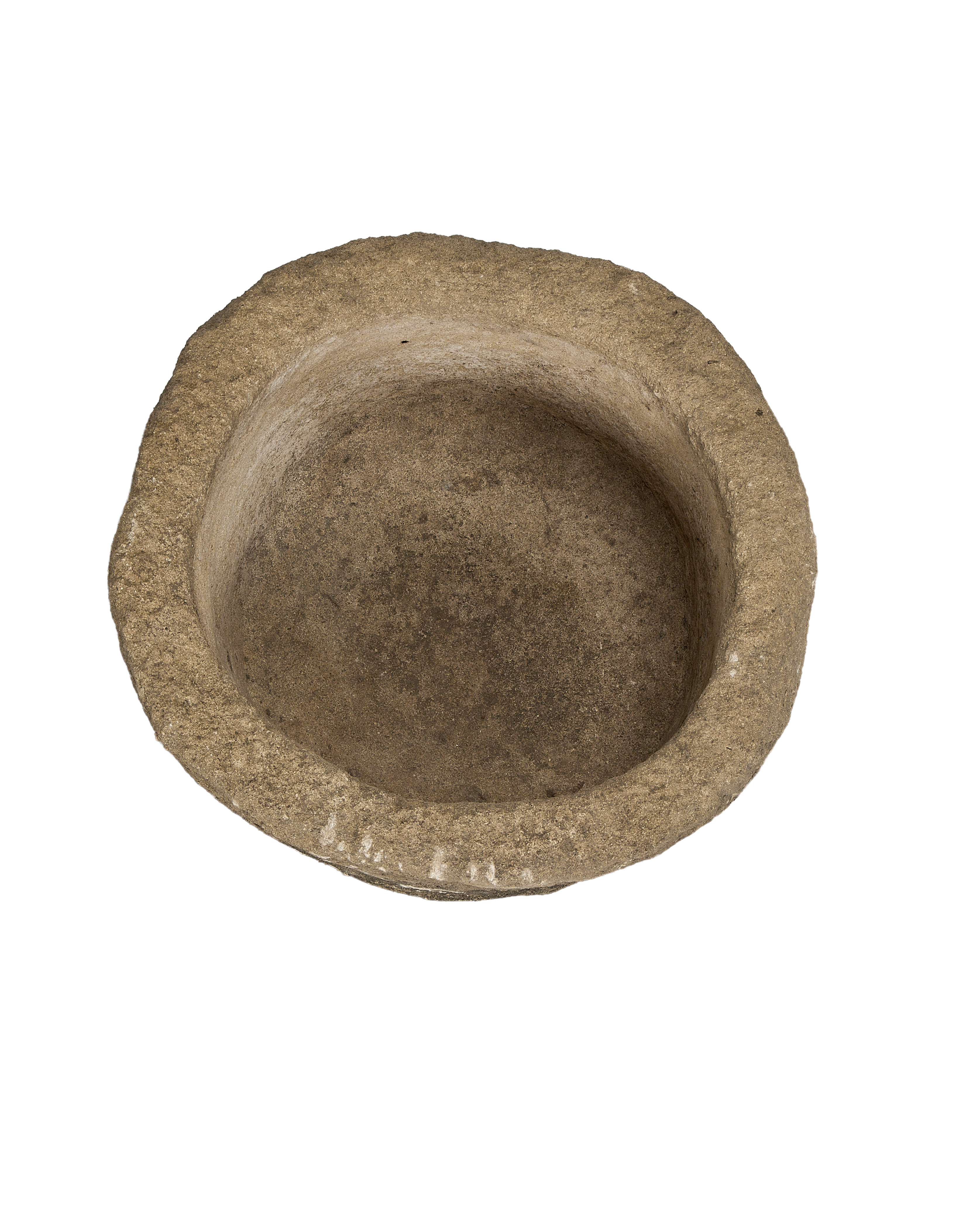 Round vintage Indonesian limestone trough with textured surface and worn interior from above.