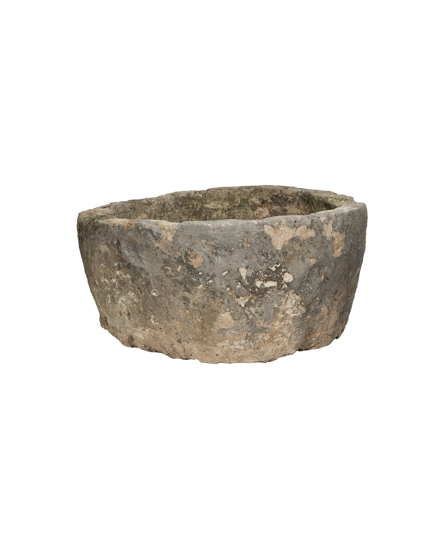 Vintage round limestone trough from Indonesia, showing rough, weathered exterior bottom and lip.