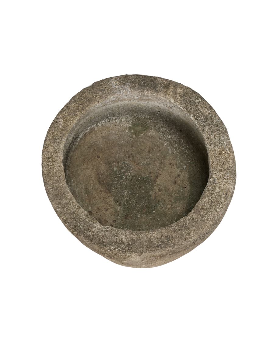 Vintage Indonesian round limestone trough, top view detail, showing interior wear and patina.
