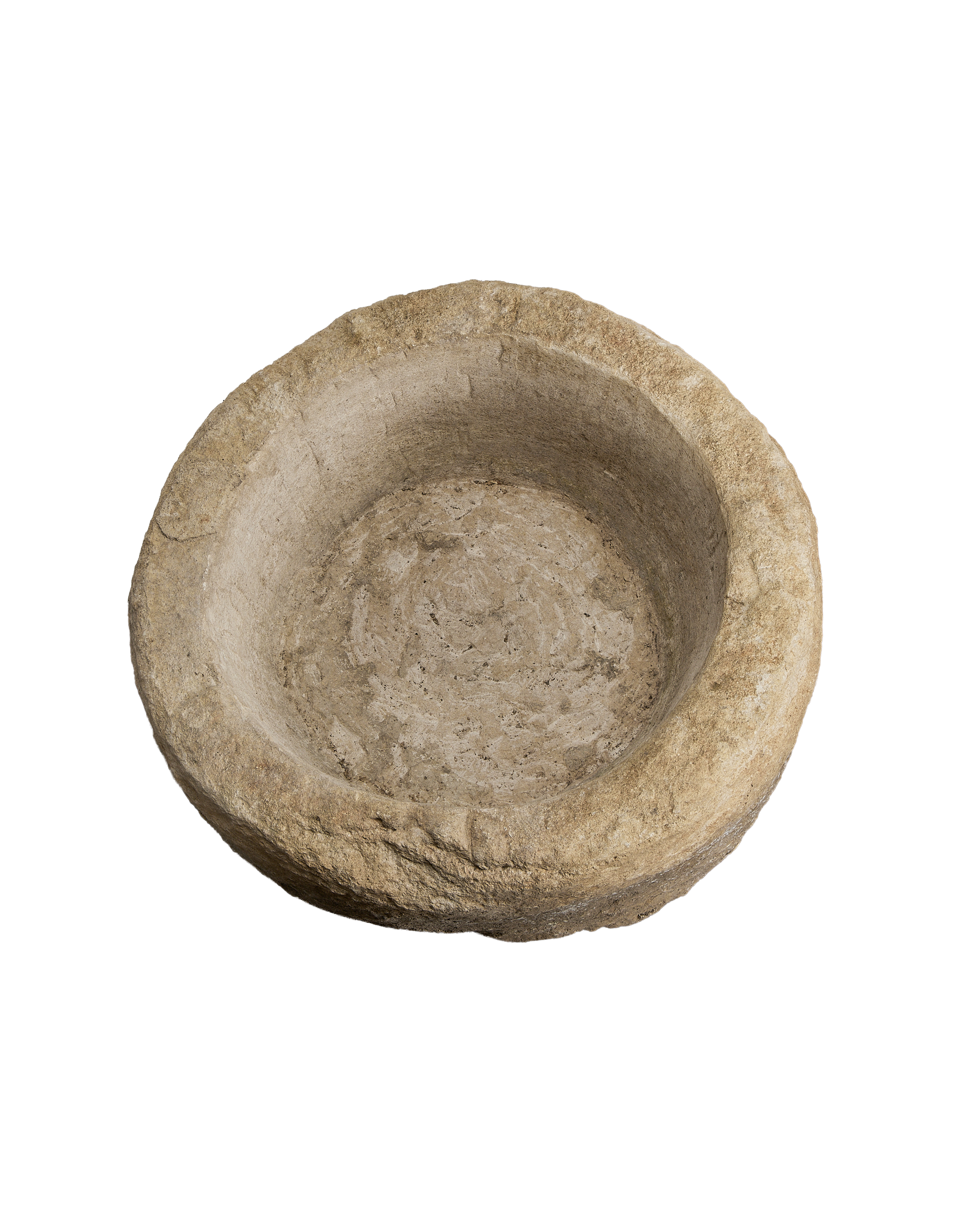 Vintage round limestone trough, top-down view showing deep interior well and rough outer texture.