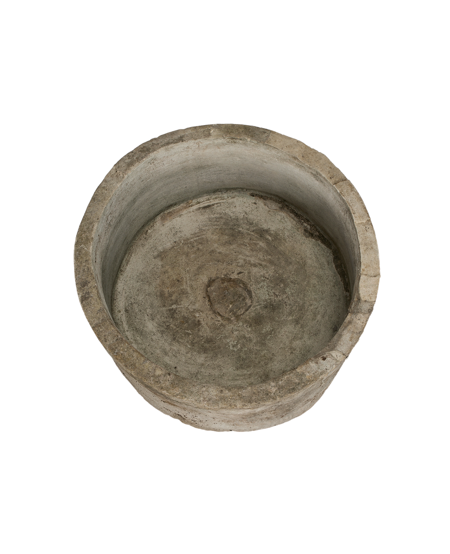 Vintage Indonesian round limestone trough, top-down view showing interior basin texture.