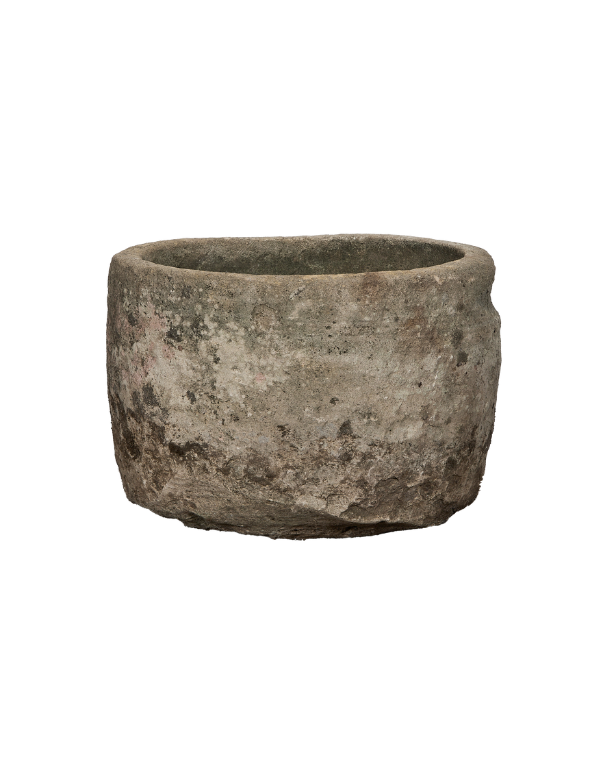 Vintage round Indonesian limestone trough, showing natural weathered texture, and unique organic imperfections.