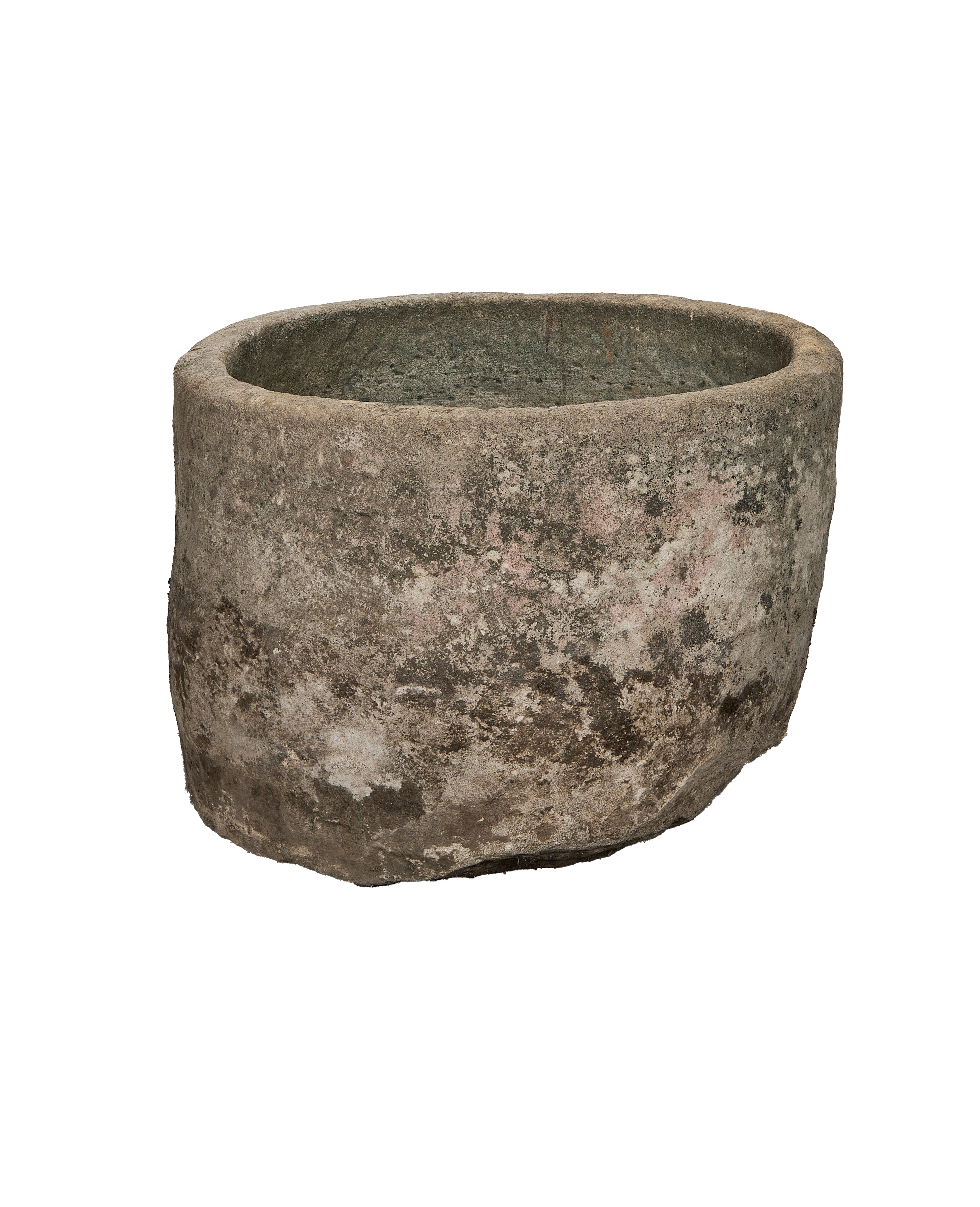 Vintage round limestone trough, rich moss and varied patina, exterior view.