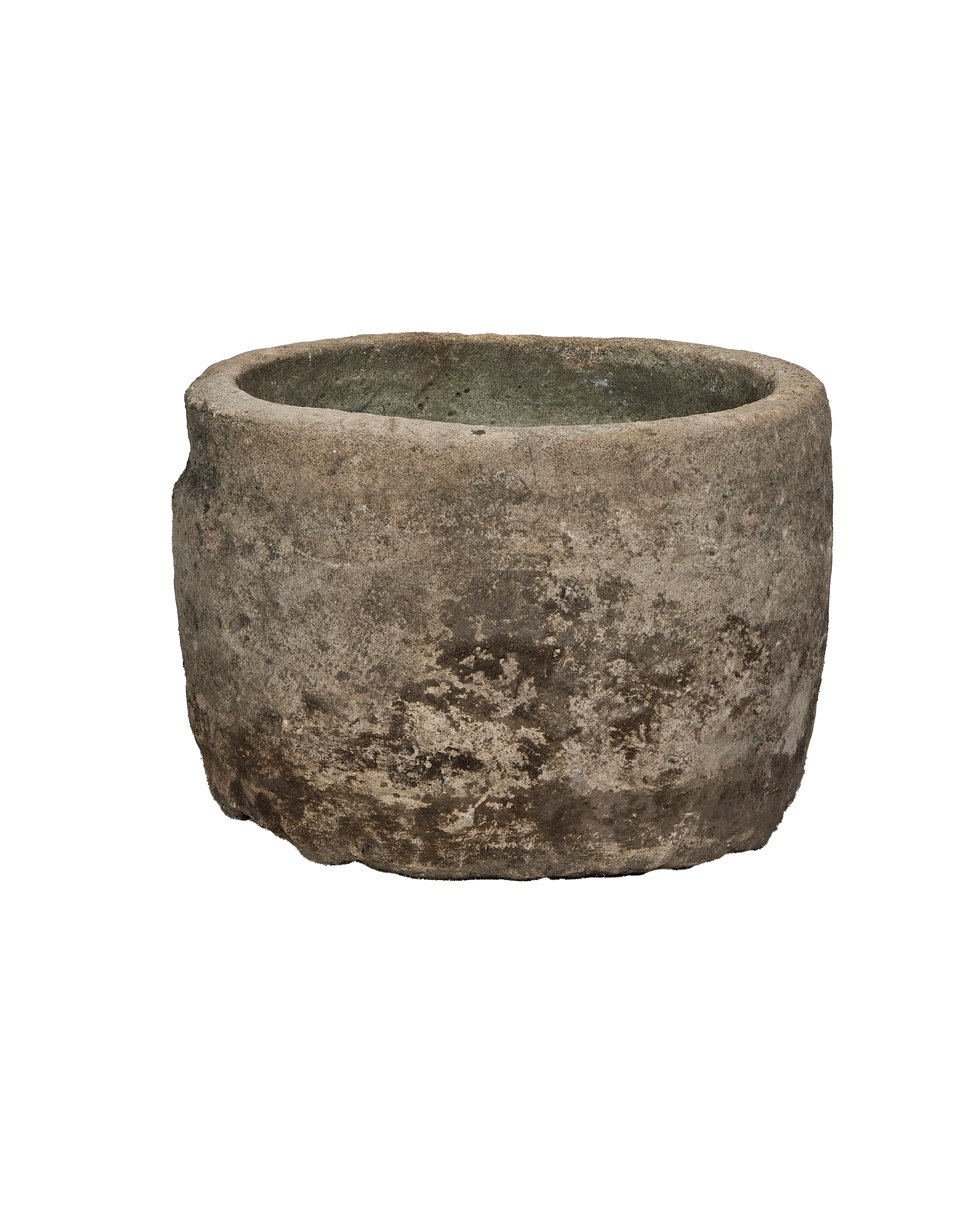 Vintage Indonesian round limestone trough, showing weathered texture and natural gray-green interior.