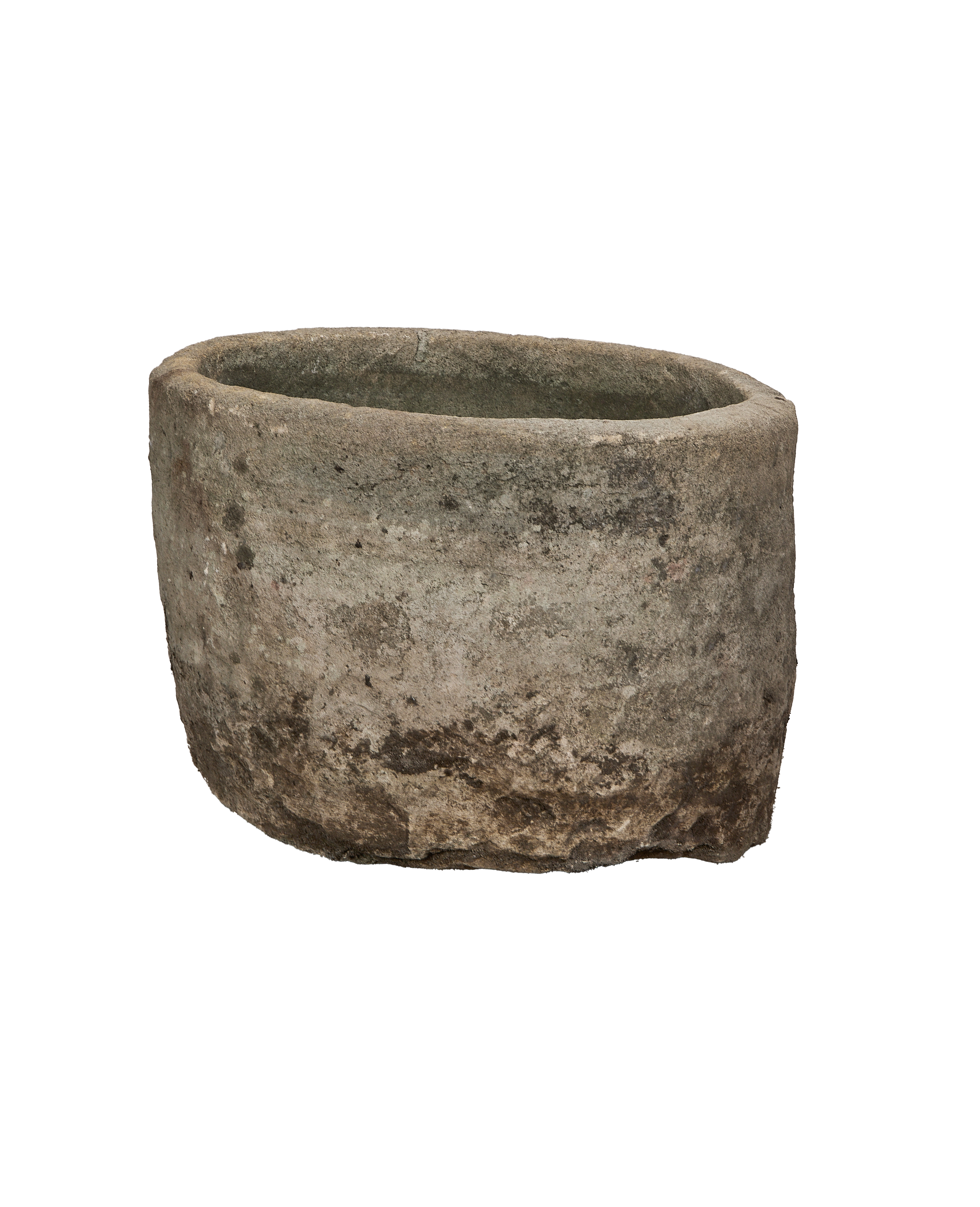 Vintage round limestone trough, aged grey patina, rough texture, isolated on black.
