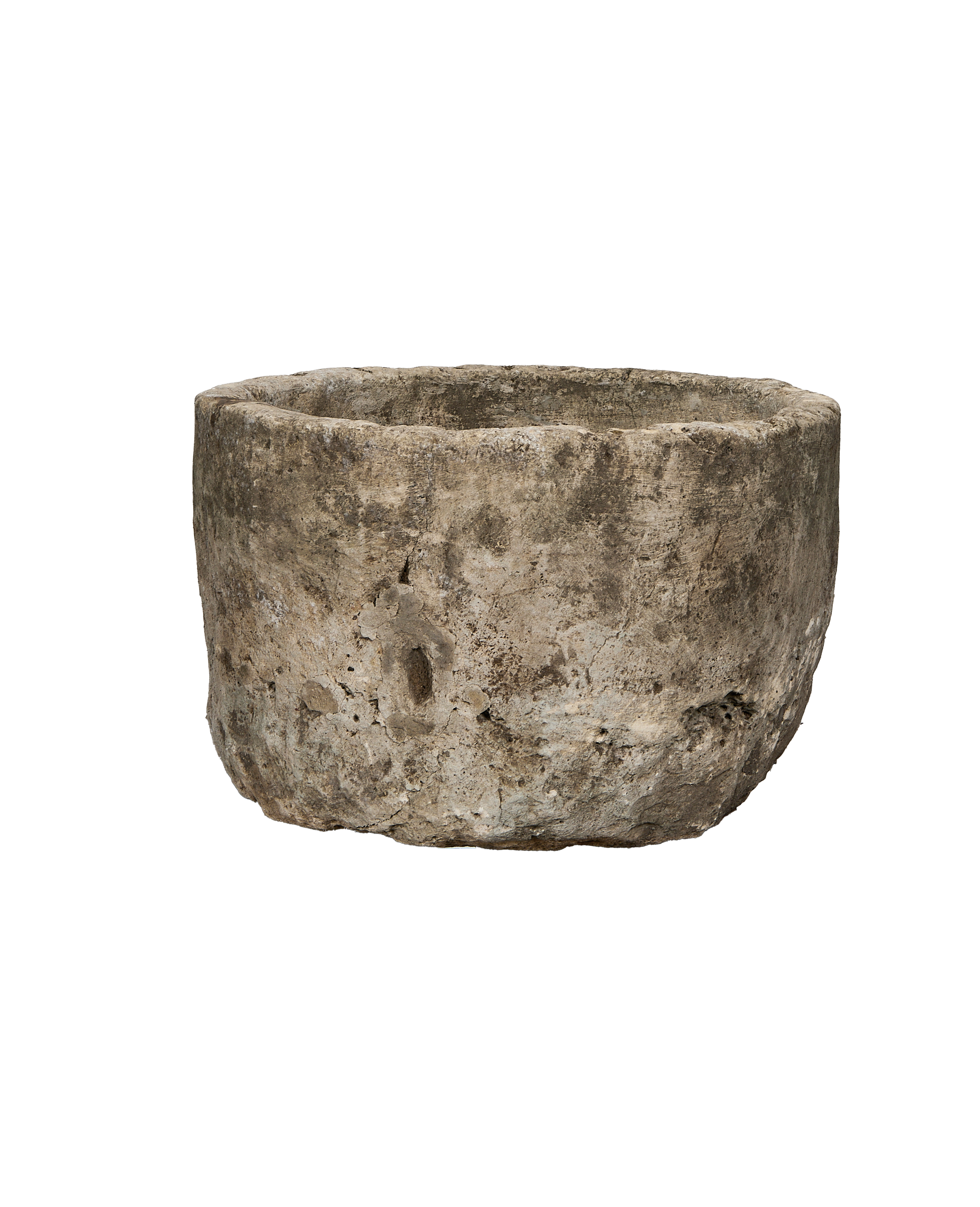 Vintage Indonesian round limestone trough, showing surface texture, cracks, and weathered patina.