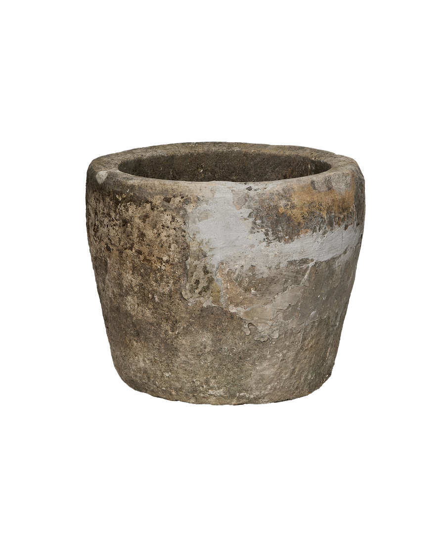 Vintage Indonesian limestone trough, round, showing distressed side with weathered patina.