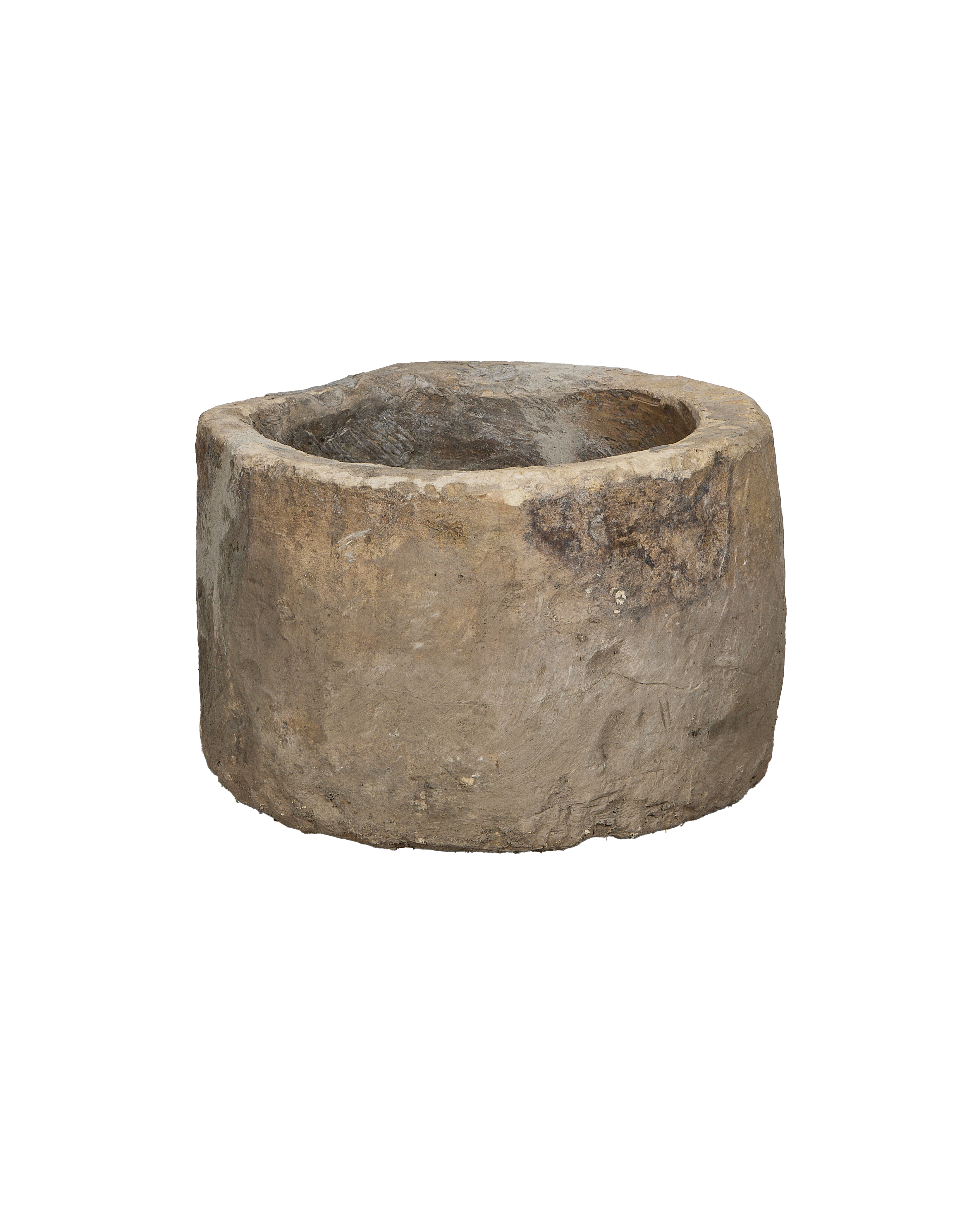 Vintage Indonesian round limestone trough, rich exterior texture, close-up.