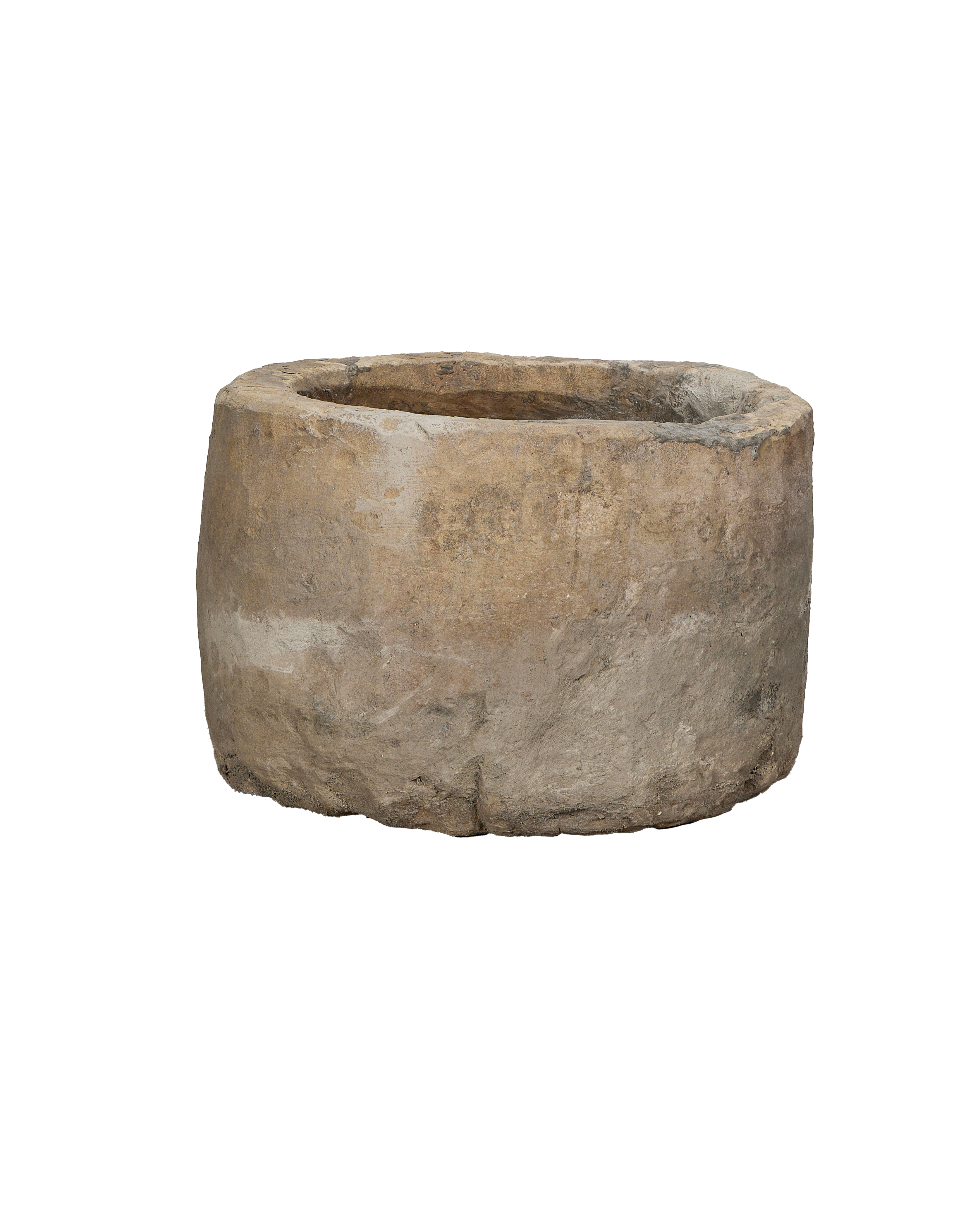 Vintage Indonesian round limestone trough, showing a full view of its textured exterior.
