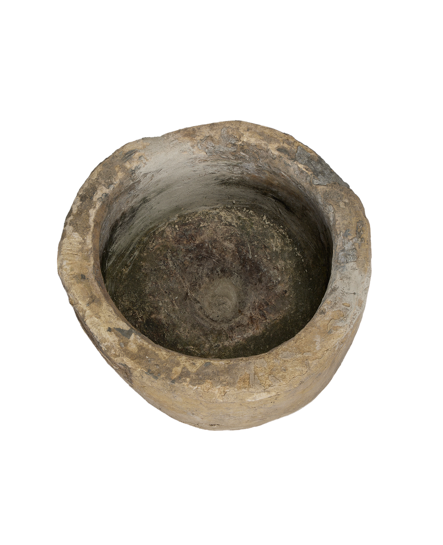 Vintage Indonesian limestone trough, top-down view highlighting the round shape and weathered interior.