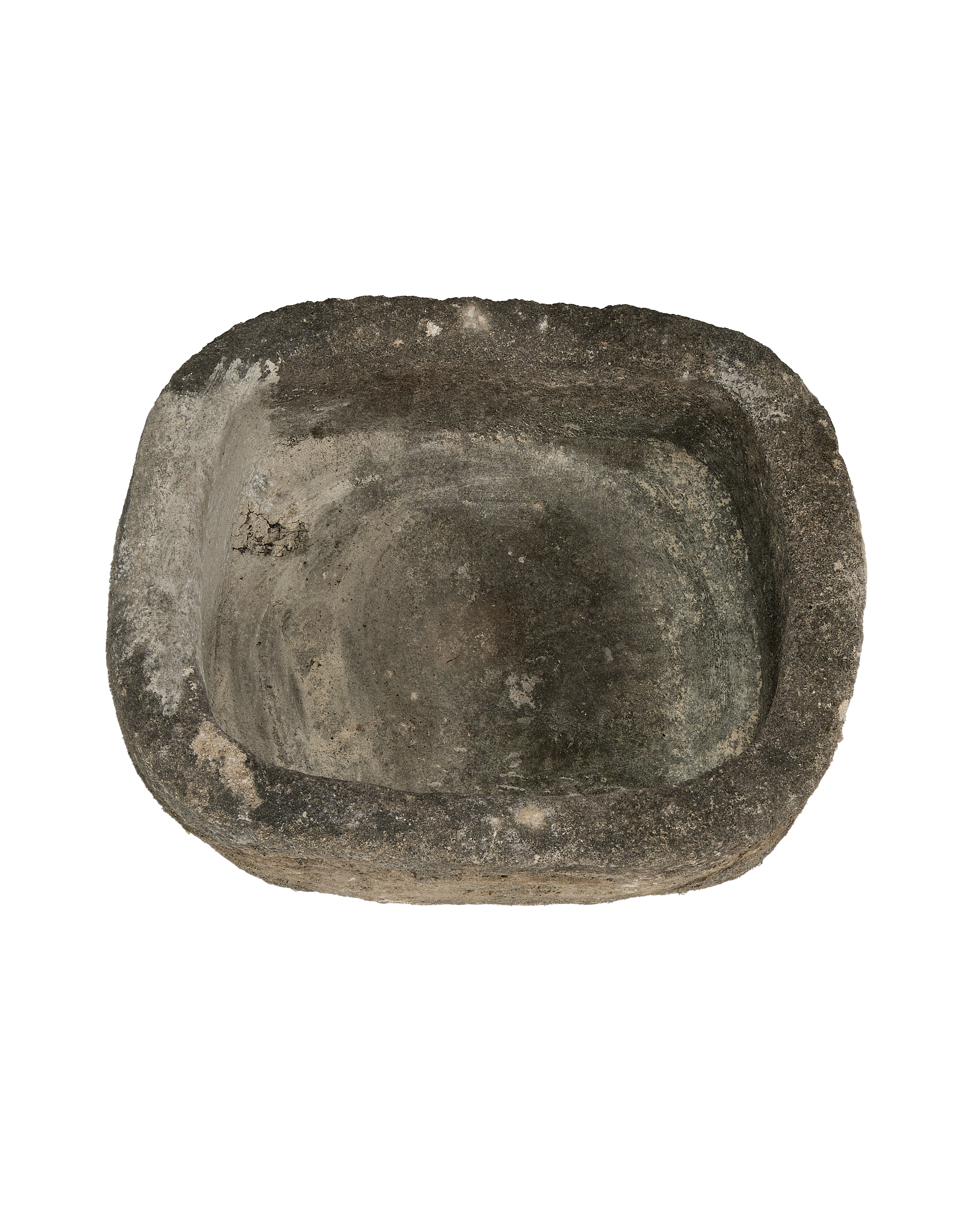 Vintage Indonesian limestone trough closeup, showcasing aged, weathered surface and organic oblong shape.