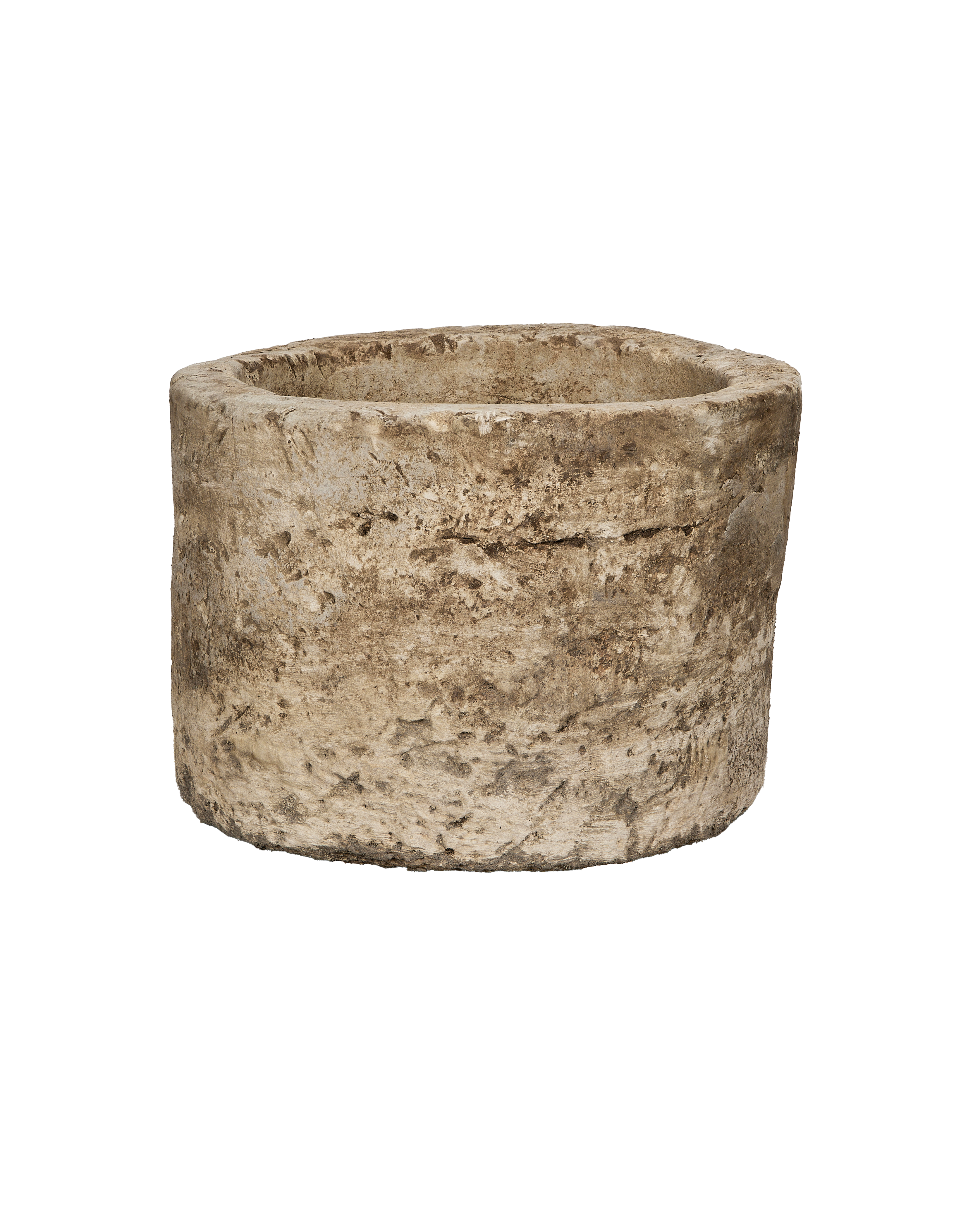 Vintage Indonesian round limestone trough, showing its rough, weathered texture from an elevated angle.