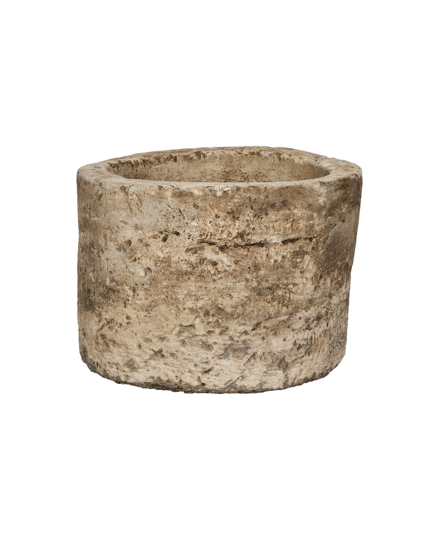 Vintage Indonesian round limestone trough, showing its rough, weathered texture from an elevated angle.