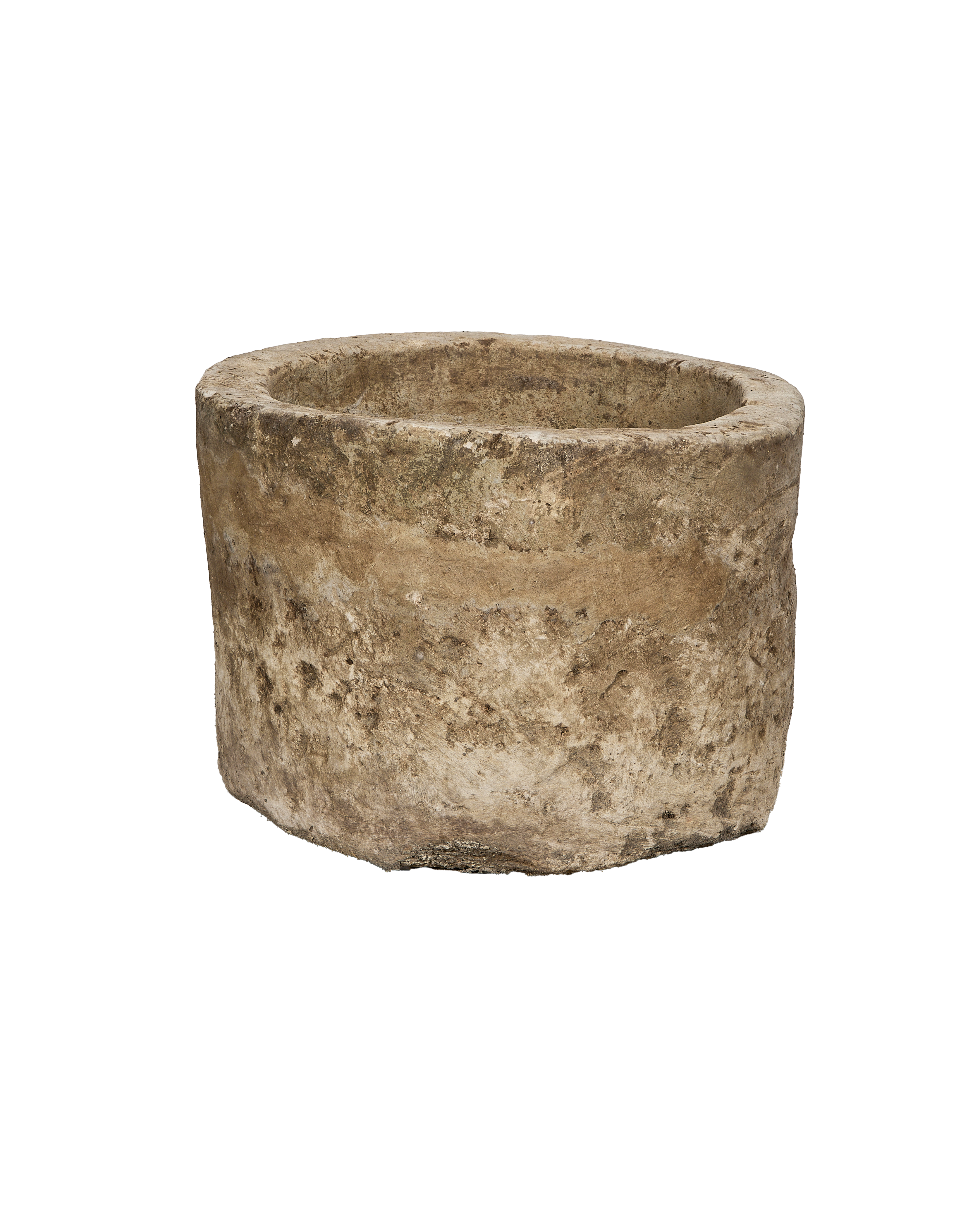 Vintage Indonesian round limestone trough, showing weathered texture from a unique low angle.