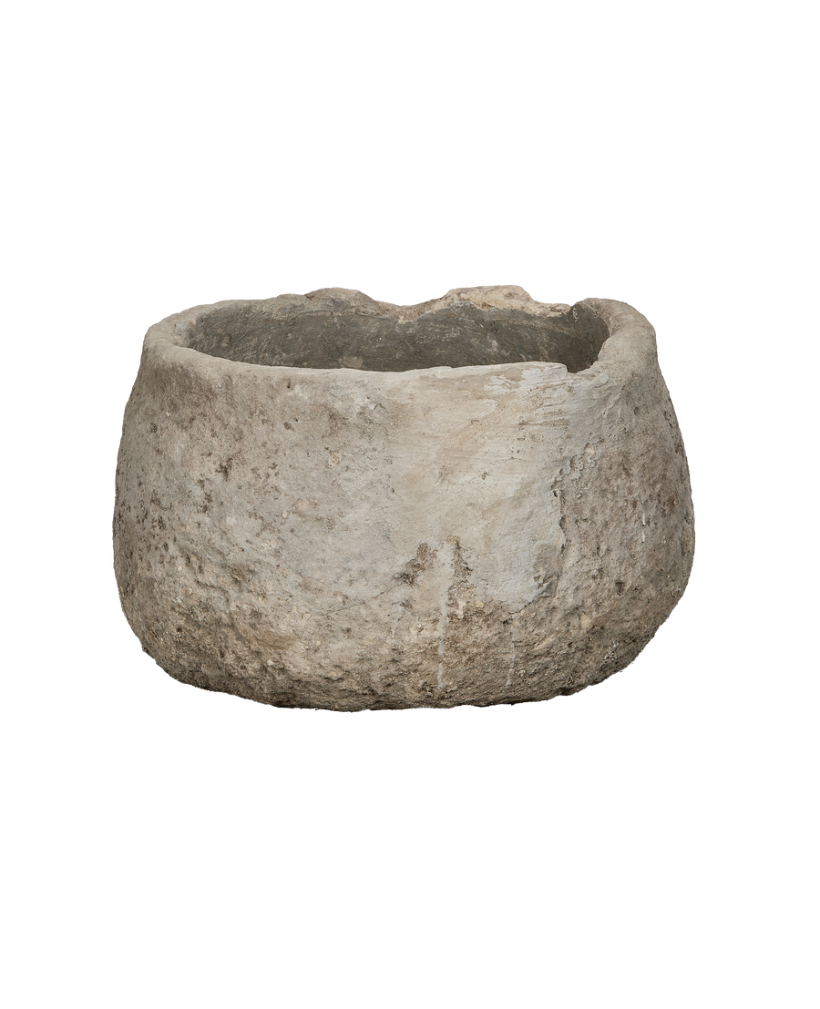Vintage round limestone trough from Indonesia, showcasing rough texture and aged patina.