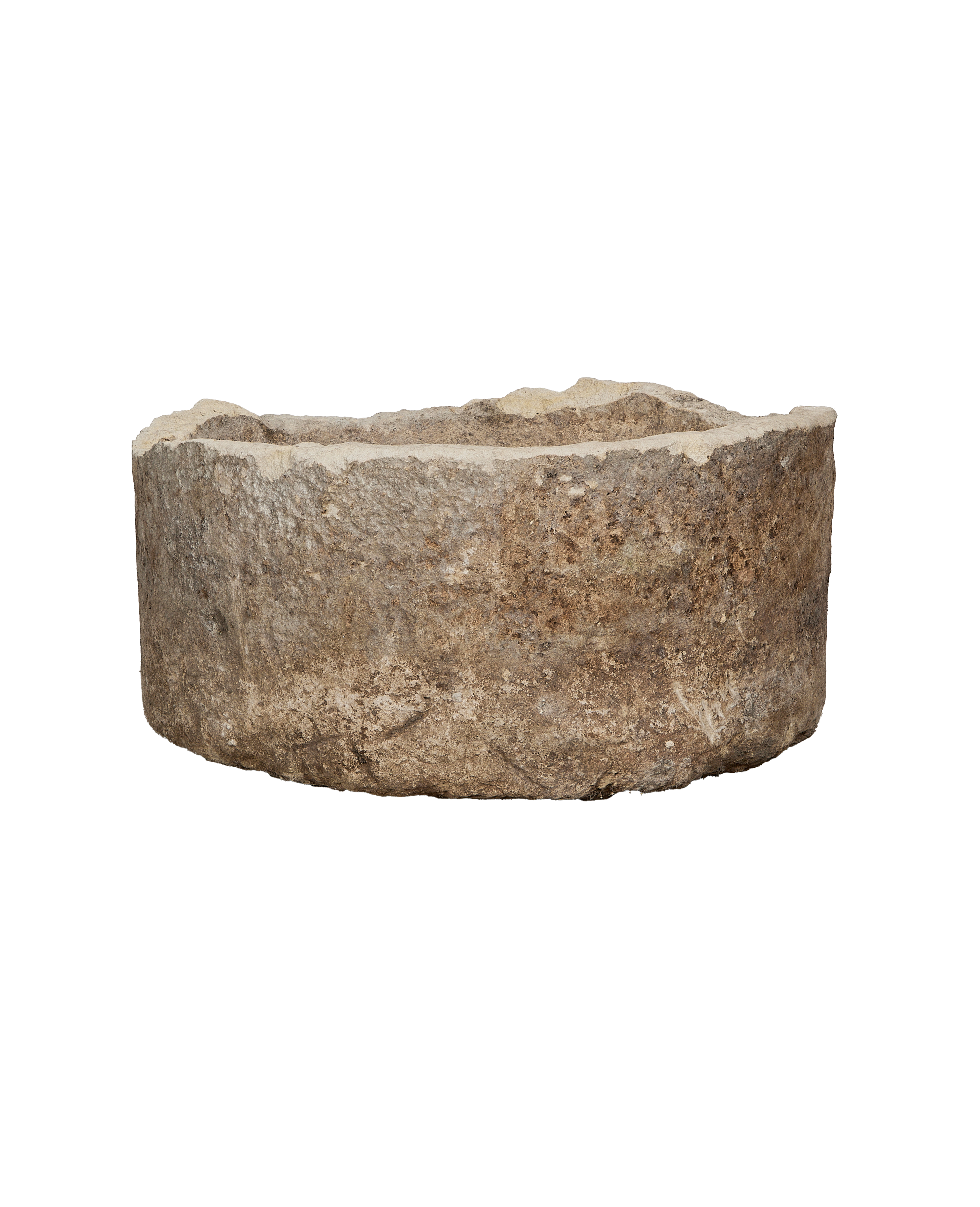 Vintage Indonesian limestone trough, round, showing detailed weathered texture and rugged edge.