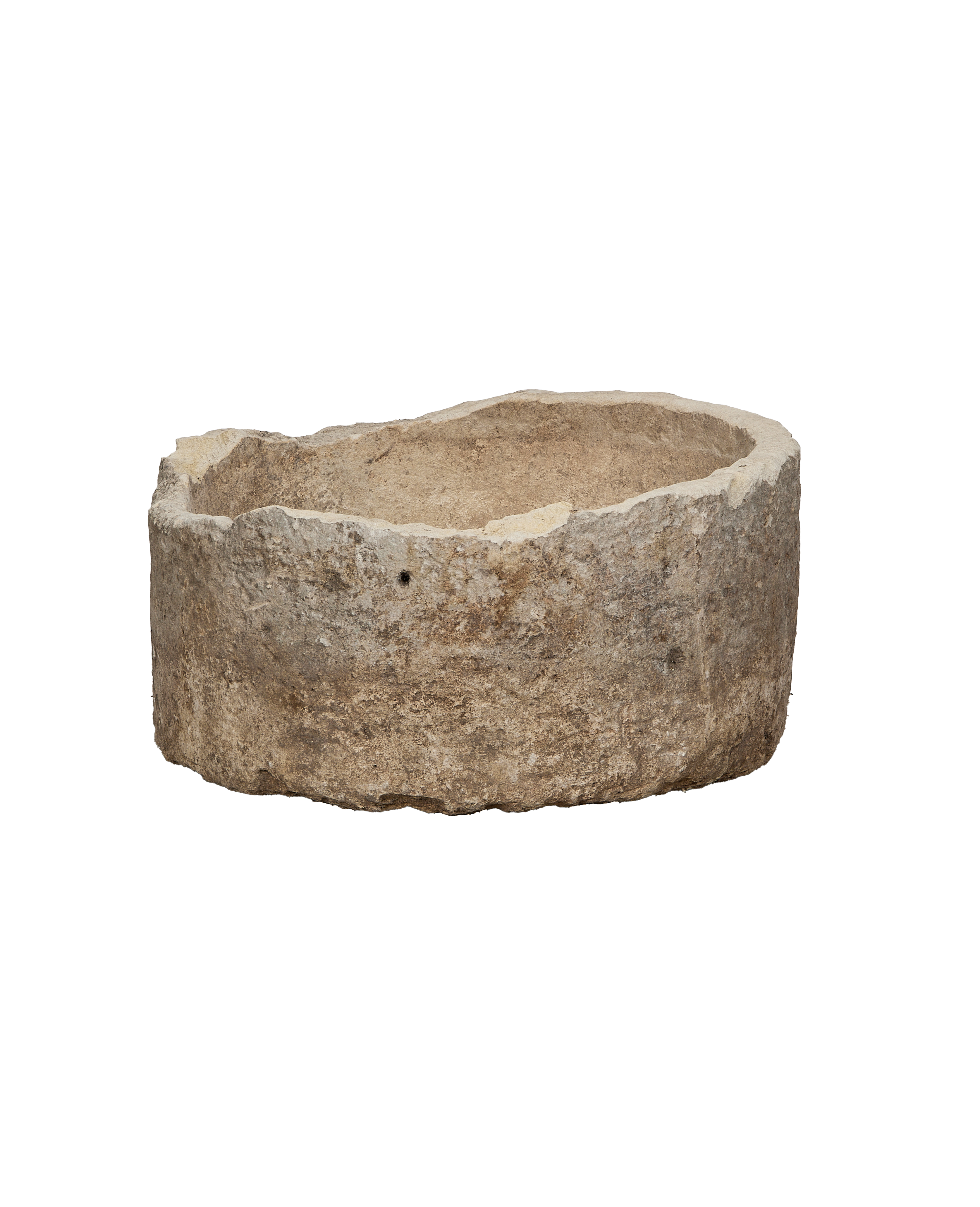 Vintage round Indonesian limestone trough, showing rugged texture and a small drill hole.
