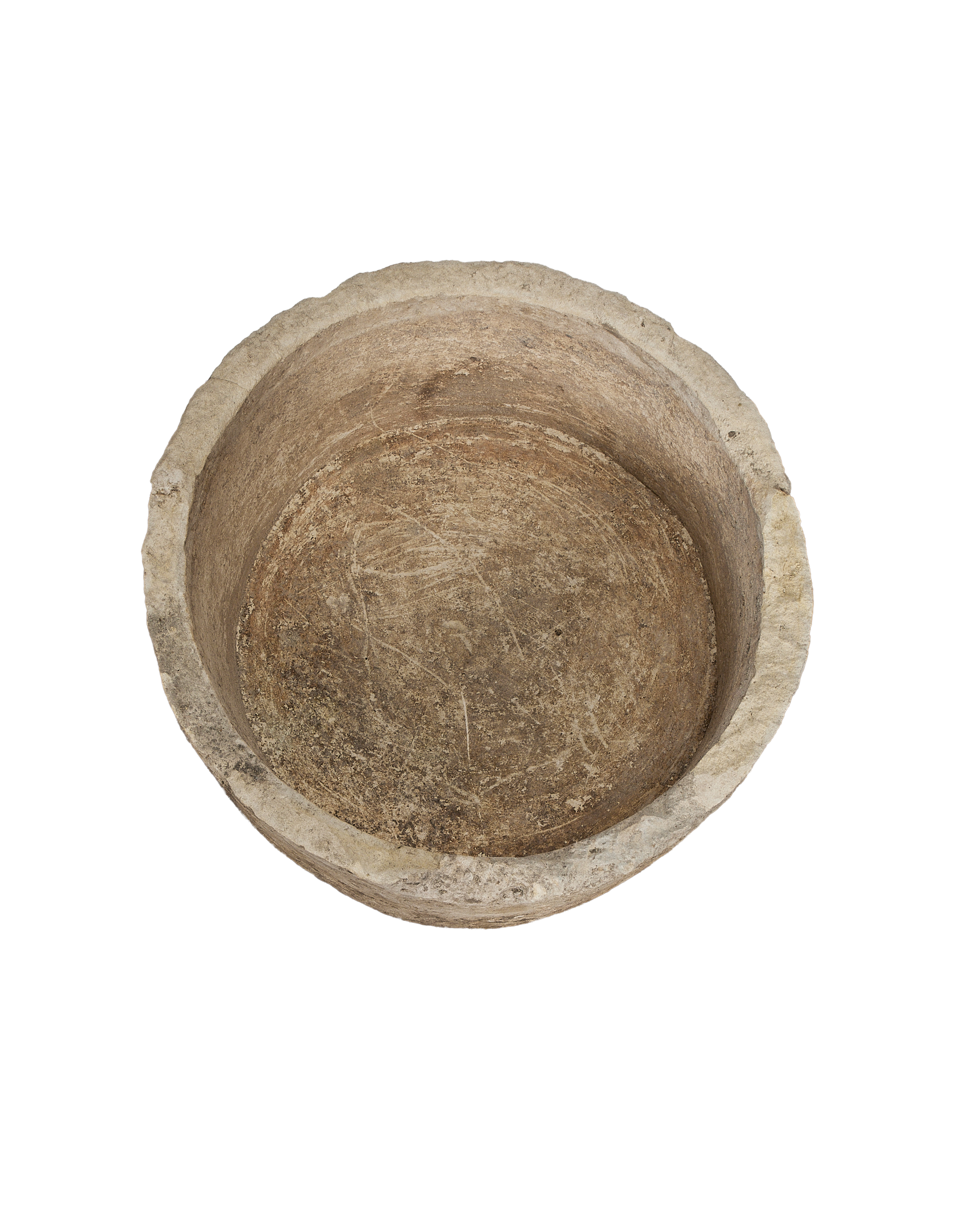 Vintage round limestone trough, top view showing weathered interior surface texture.