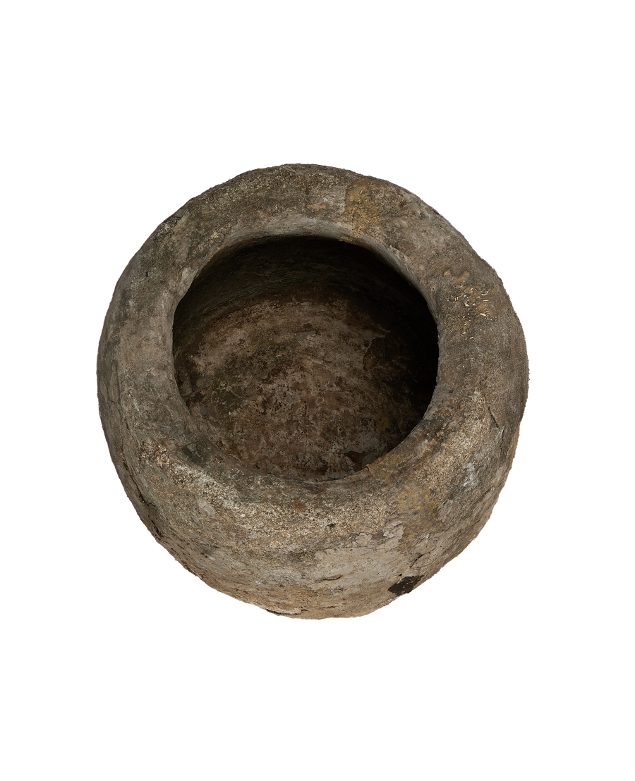 Vintage round limestone trough, top view showing weathered patina and deep interior.