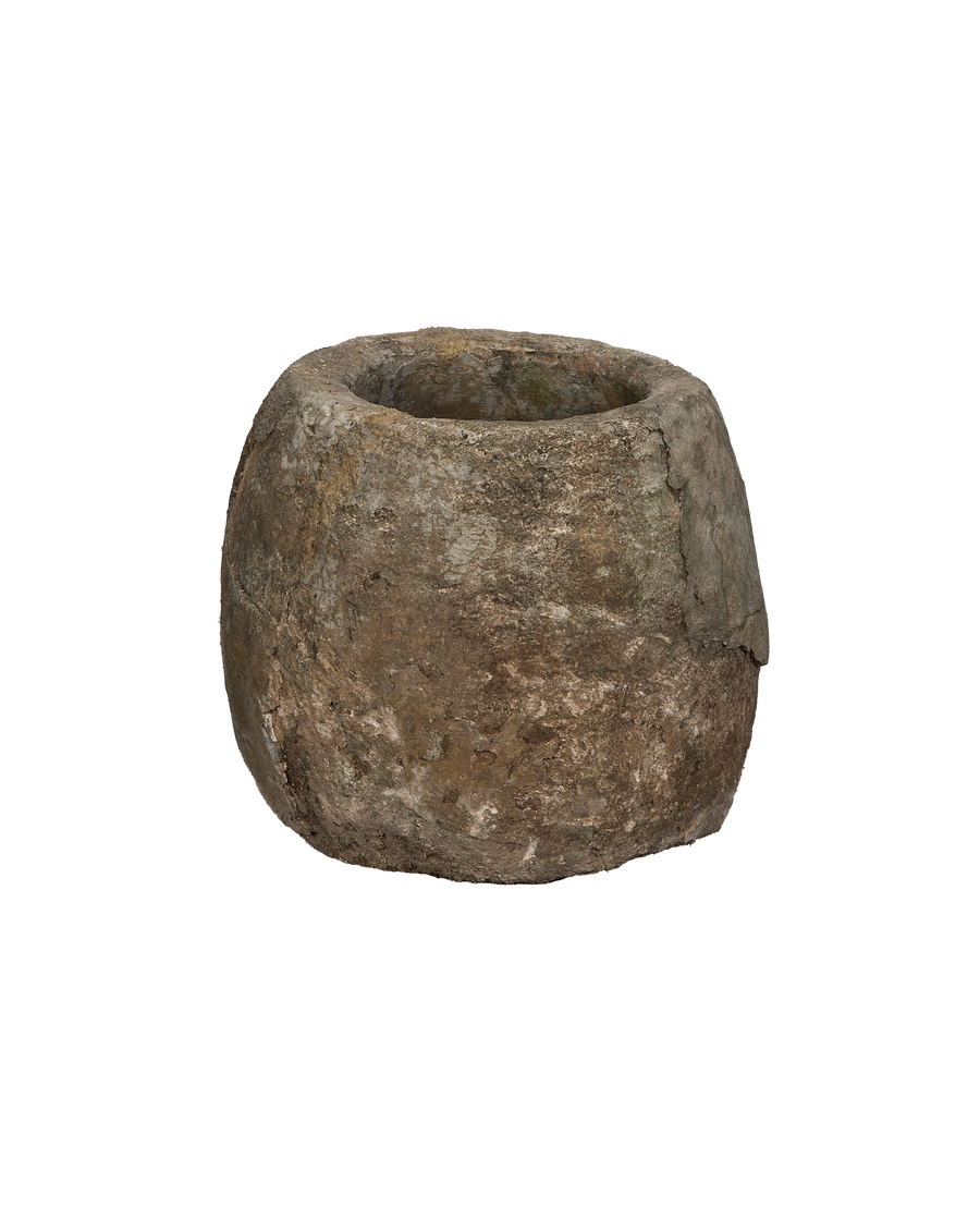 Vintage Indonesian round limestone trough, showing a close-up of its textured, weathered exterior.