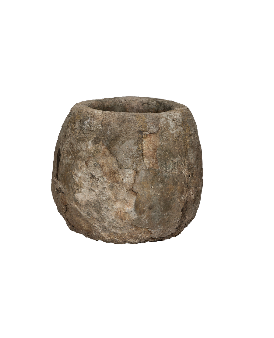 Round vintage Indonesian limestone trough with textured, weathered surface and subtle cracks.